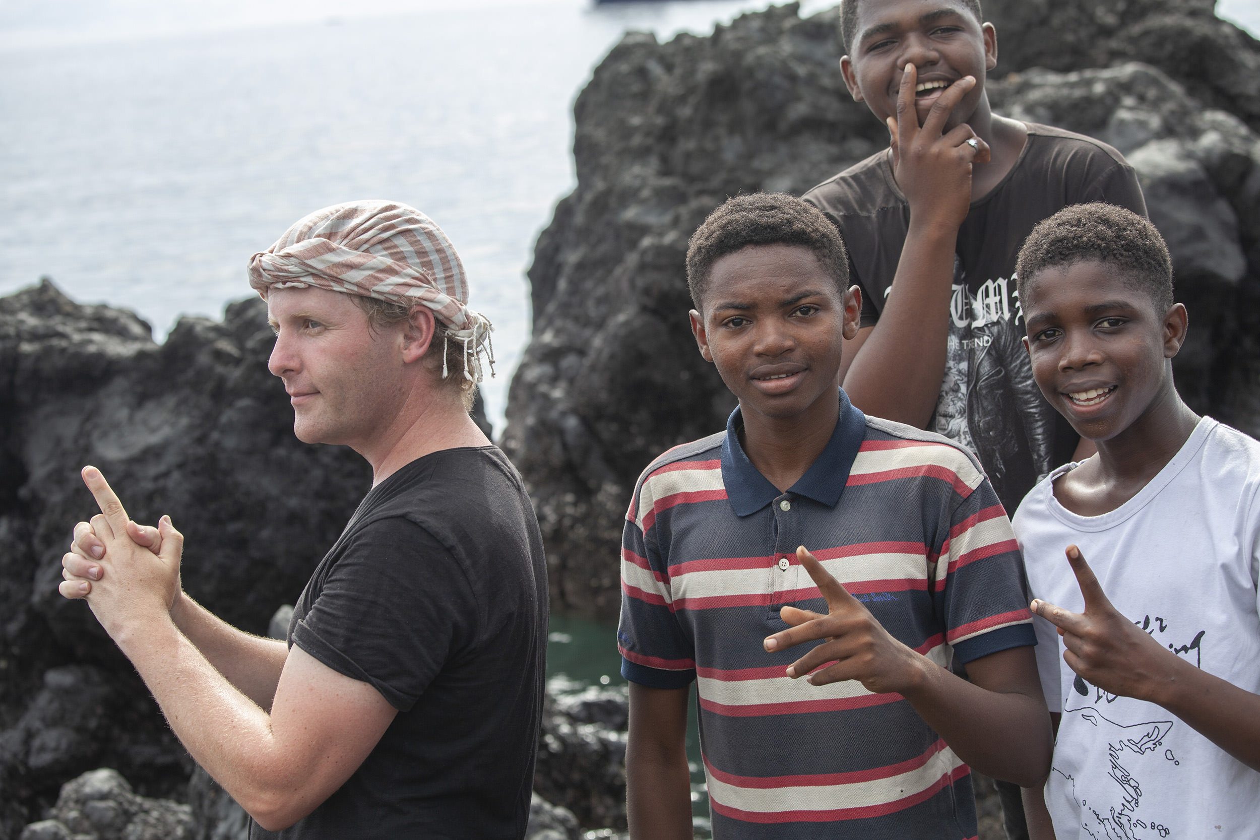 Ben posing with local Comorian boys in Moroni Comoros