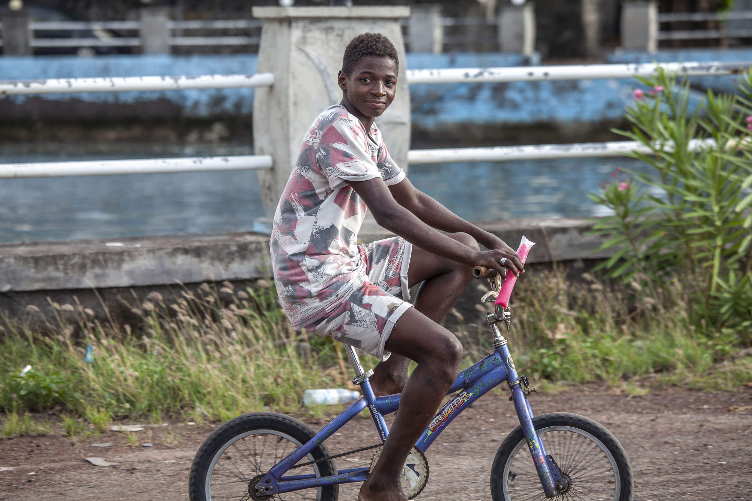 Boy riding bicycle in Iconi Comoros