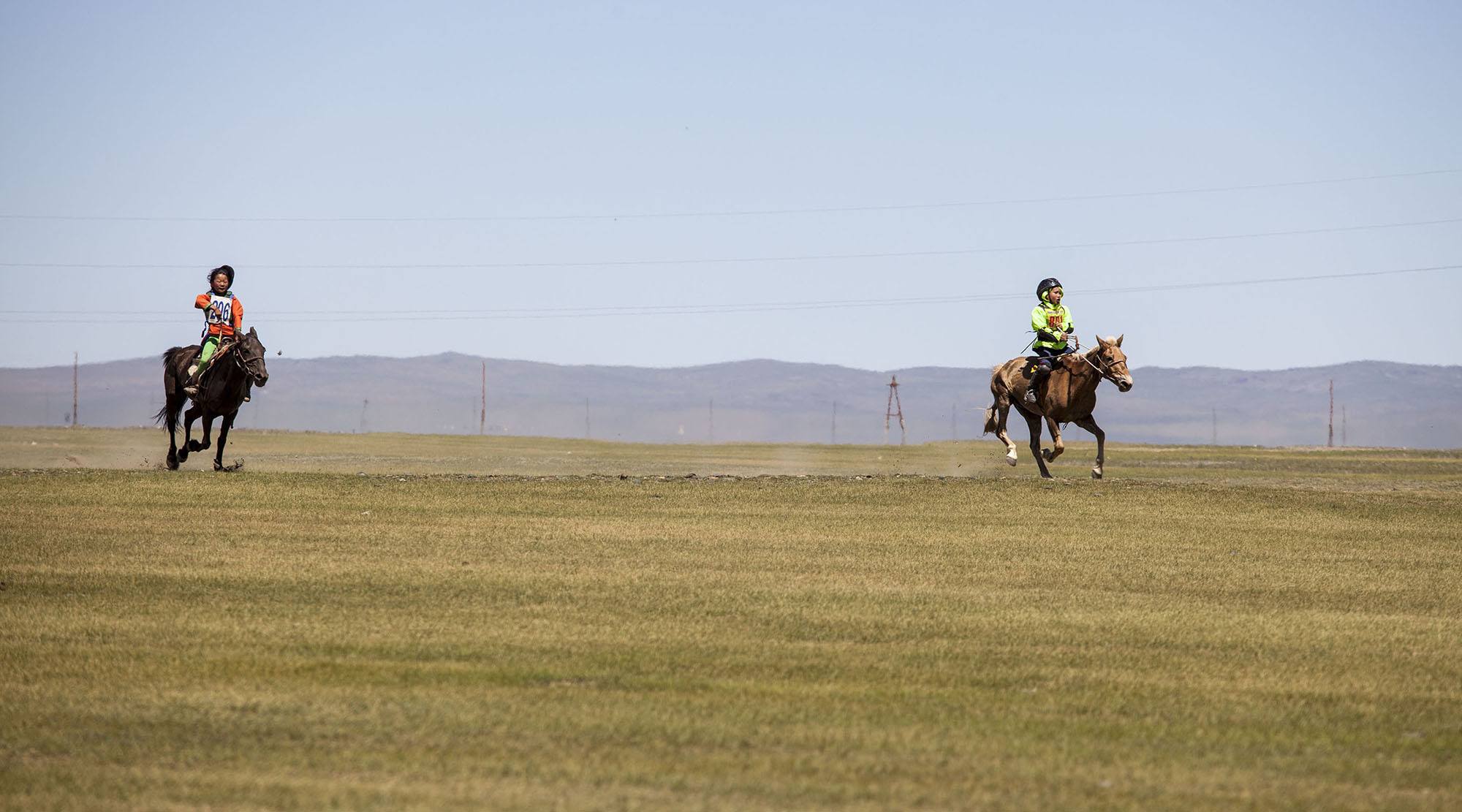 two young horse riders in Naadam race