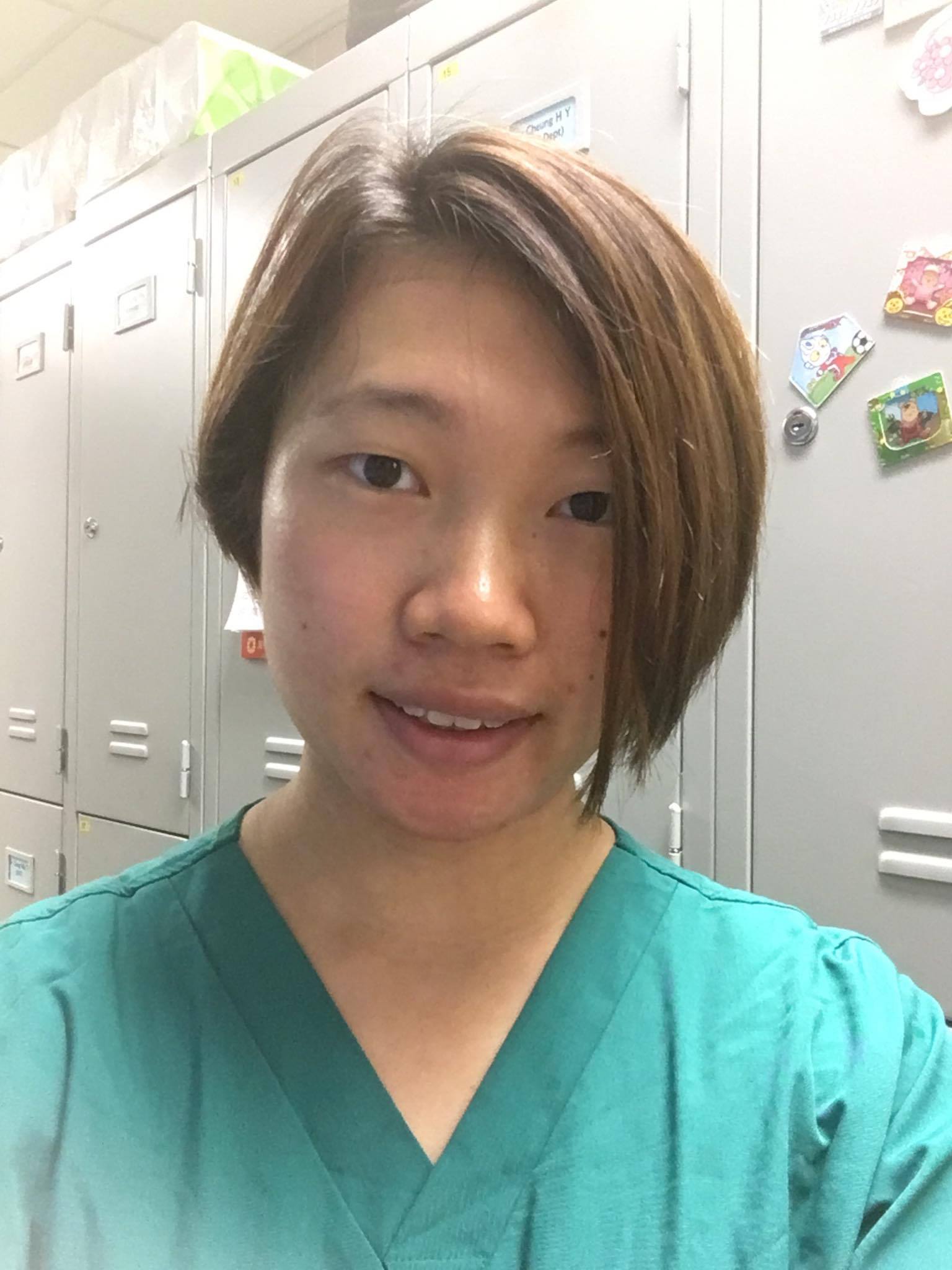 Ariel dressed in scrubs ready for work in the OT in Hong Kong