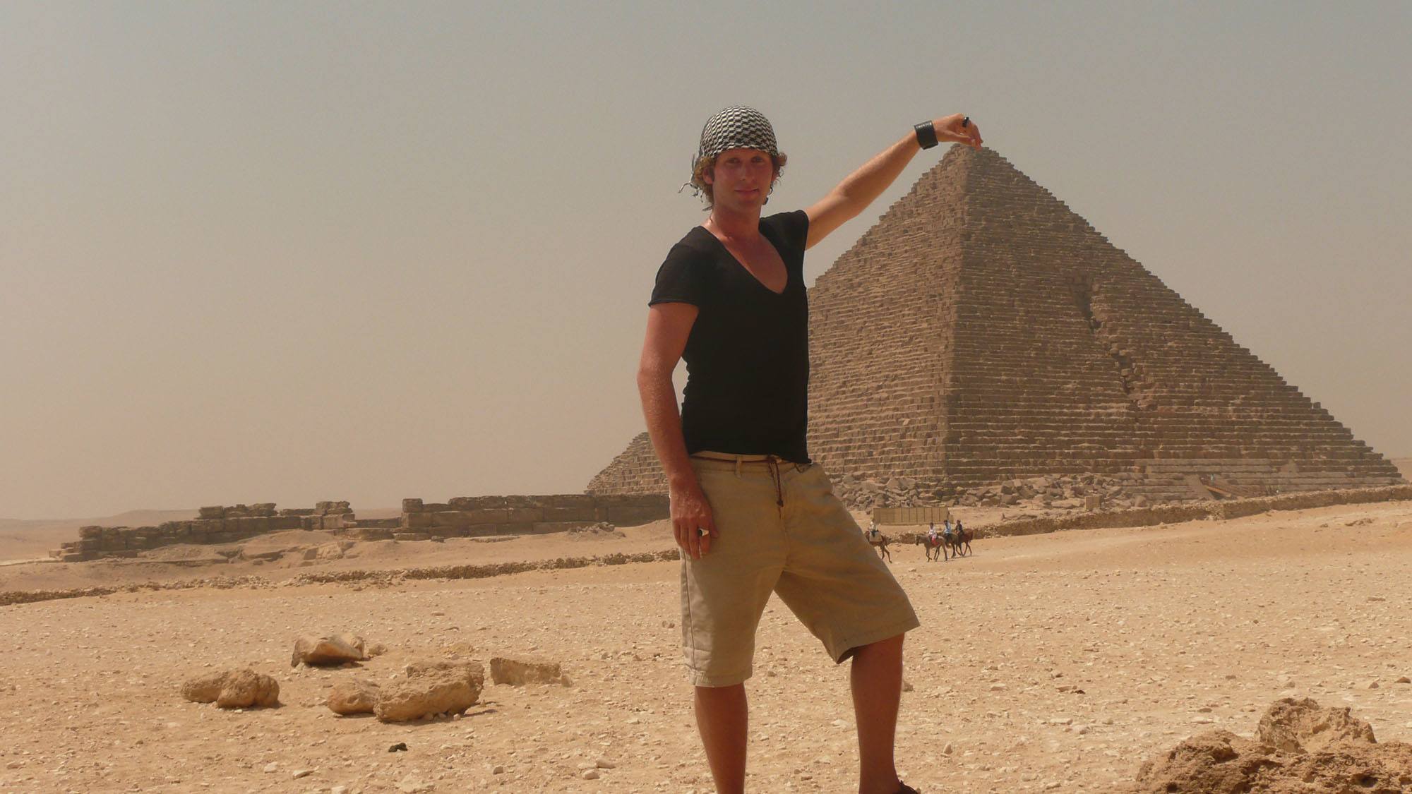 Ben posing with finger on pyramid