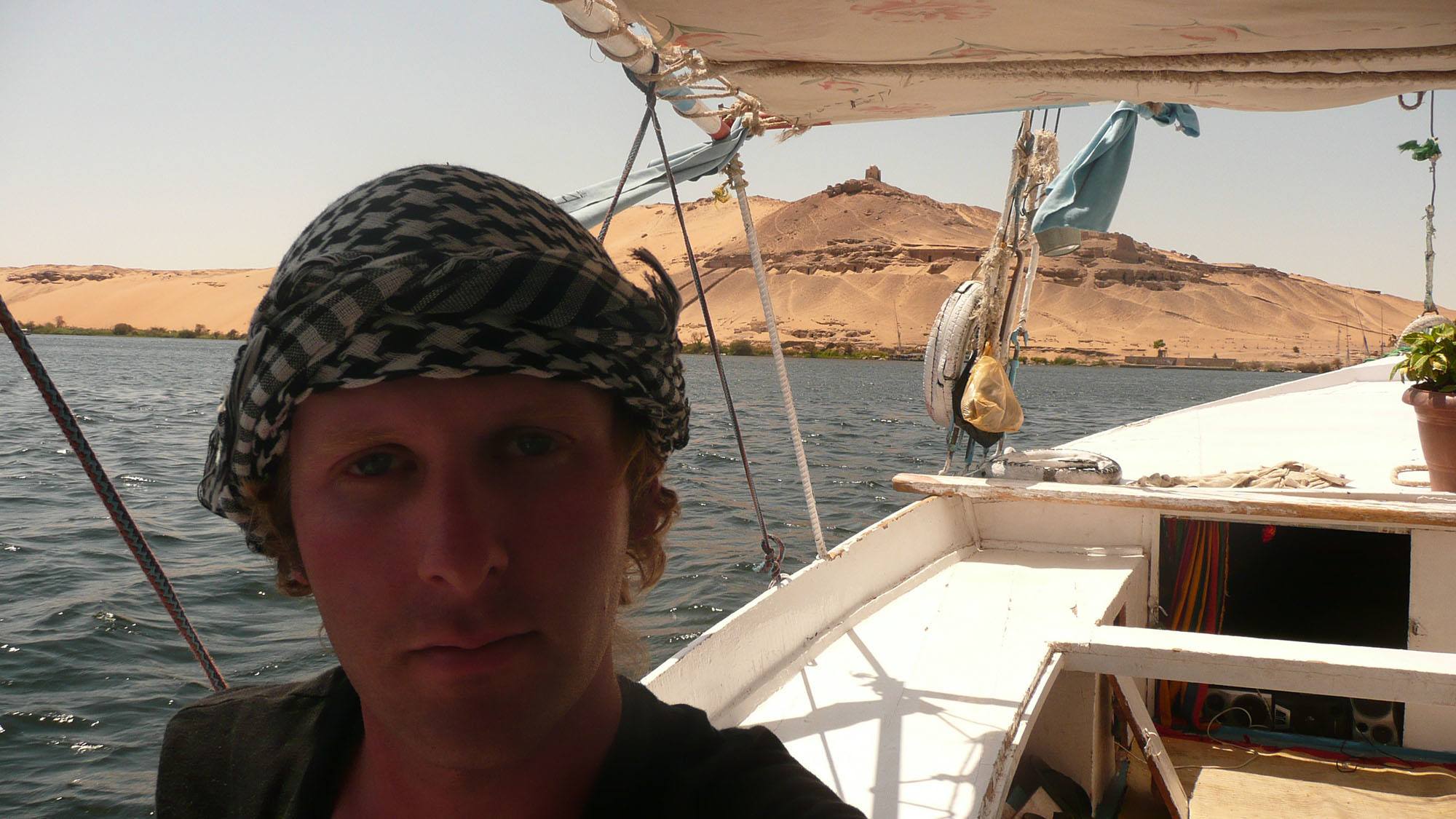 Ben wearing head scarf on Felucca sailing on Nile Egypt