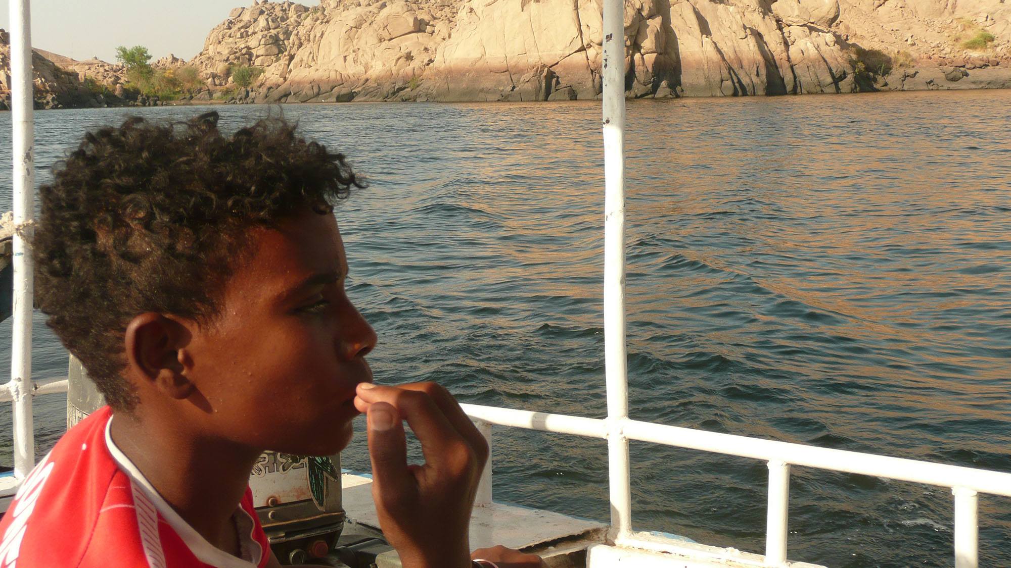 Egyptian boy on boat Aswan Egypt