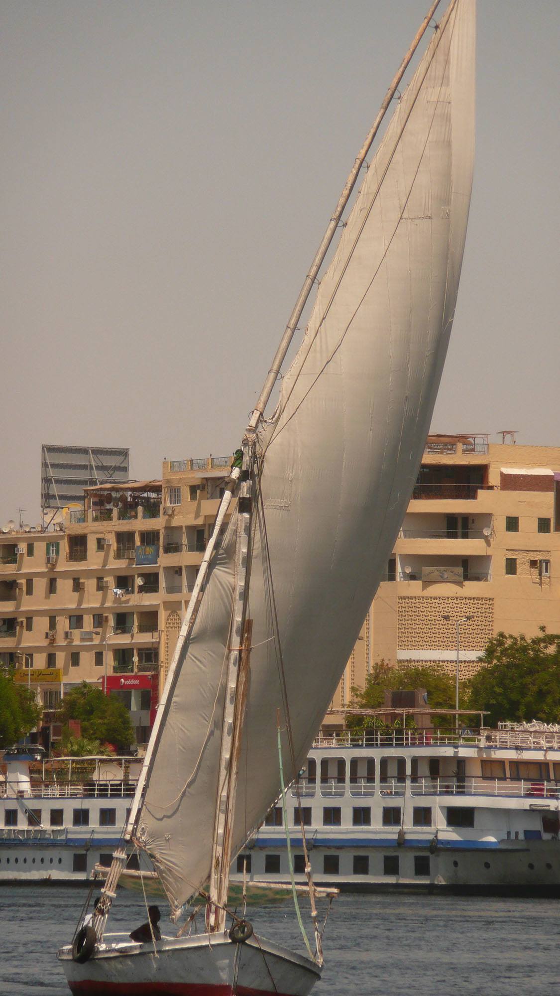 Felucca with sails erect sailing on Nile Egypt