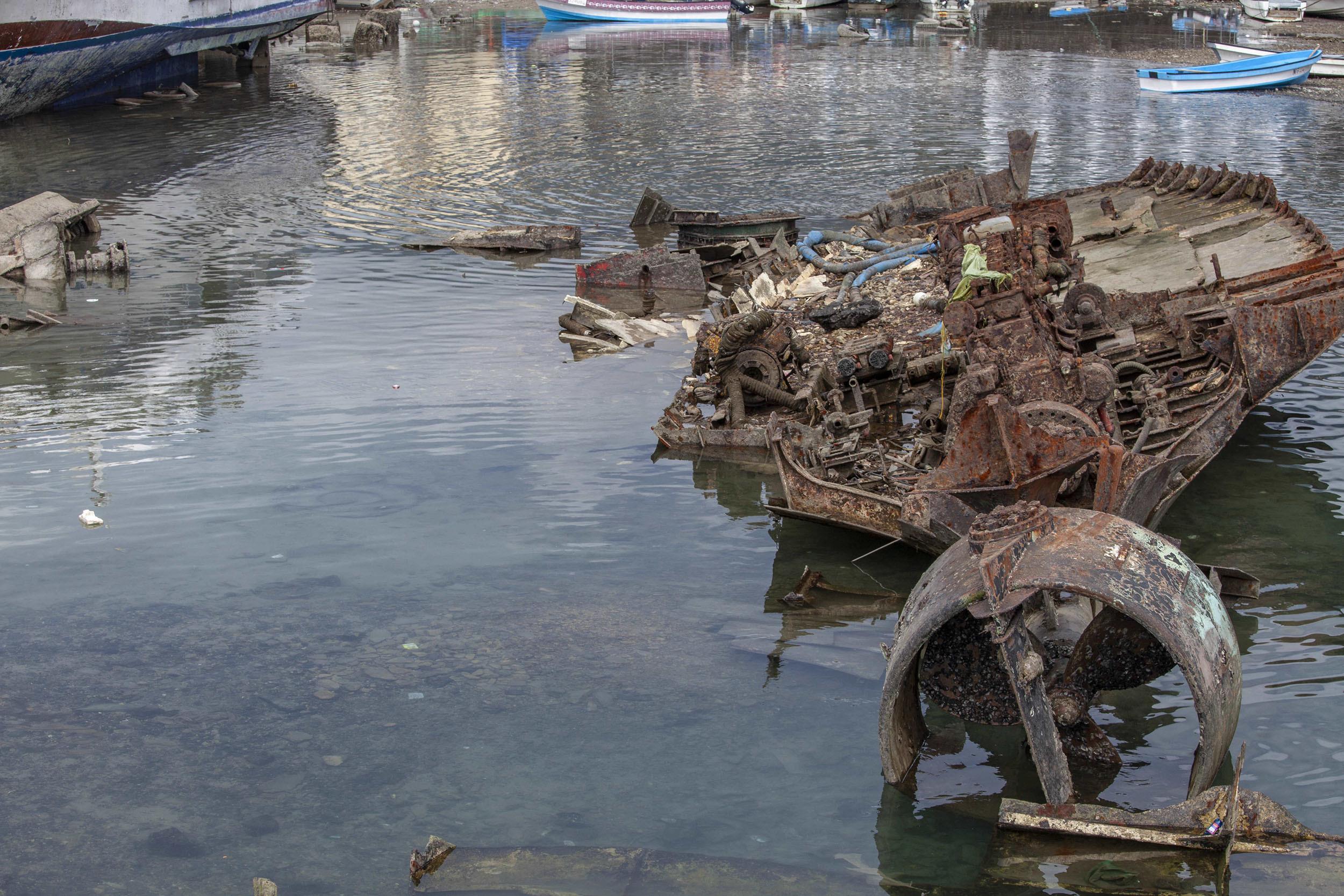 rusty abandoned half submerged ship in Moroni Port Comoros