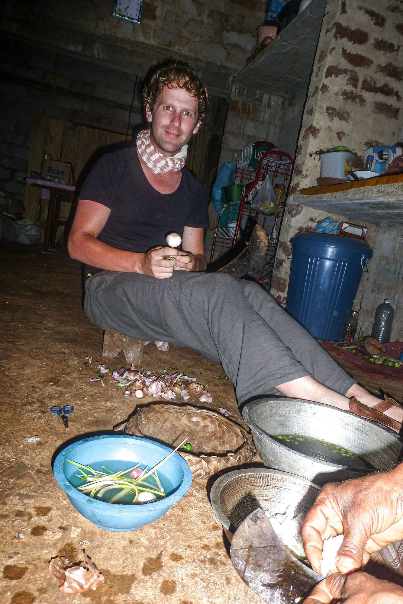 Ben helping to prepare dinner on kitchen floor of Sri Lankan home