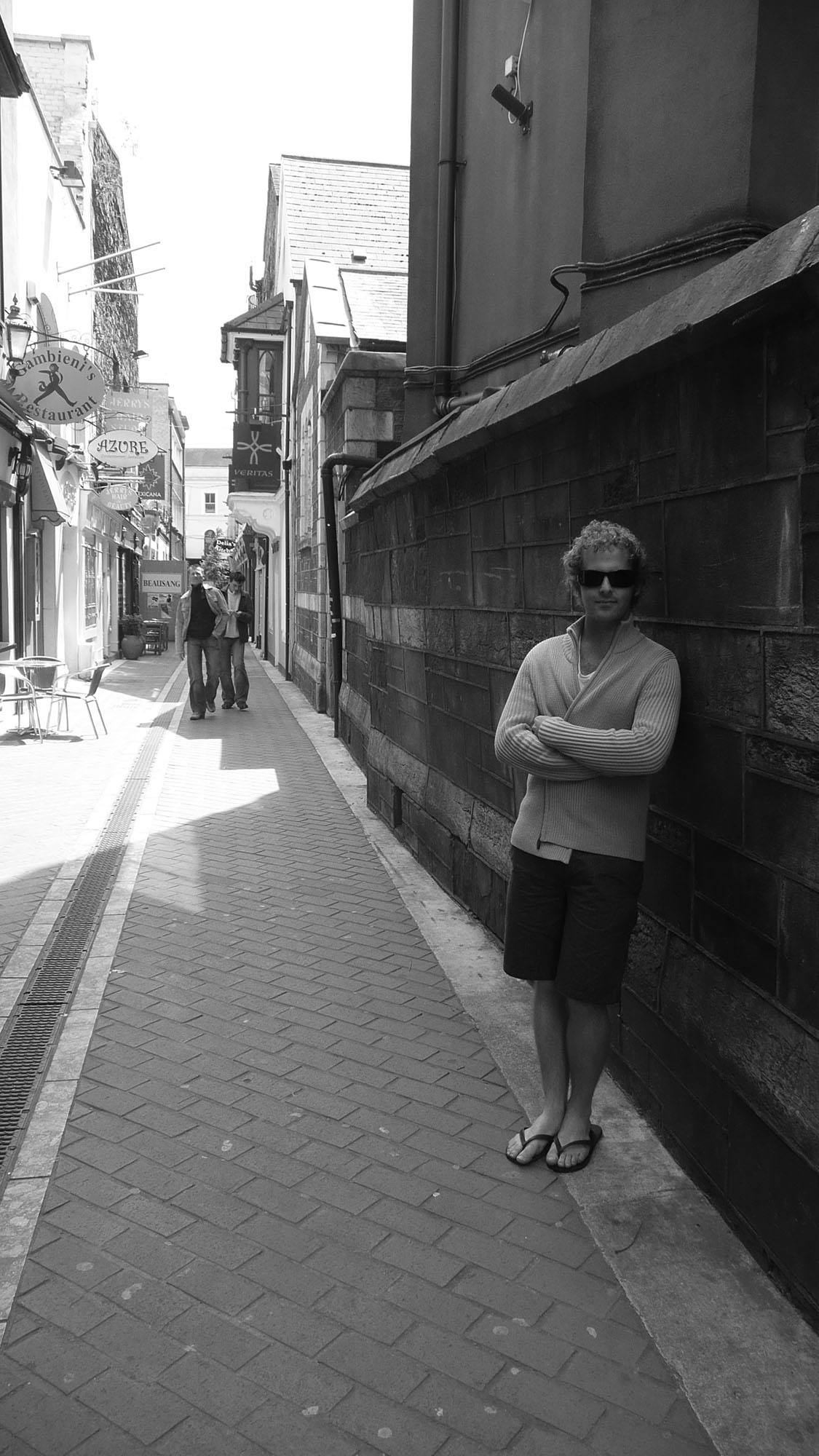 Ben leaning against a wall in Cork Ireland