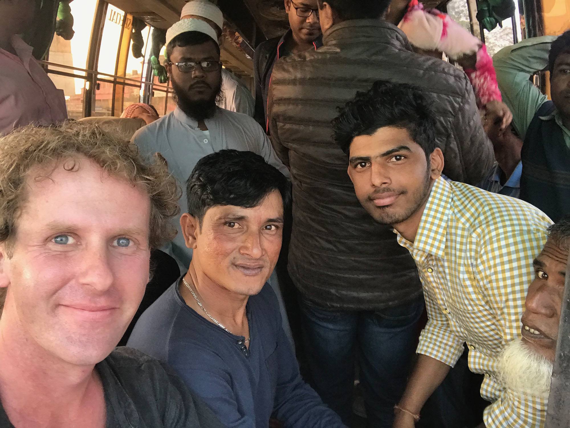 Ben on a bus with locals going to Srimangal Bangladesh