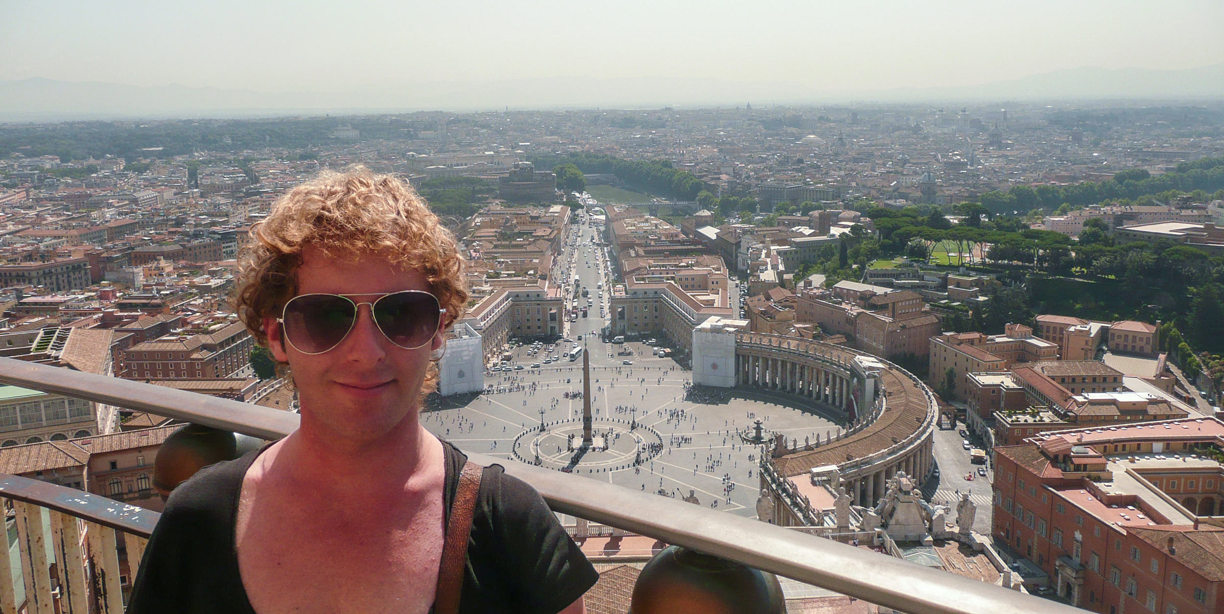 Ben standing on the Vatican roof with views of Rome