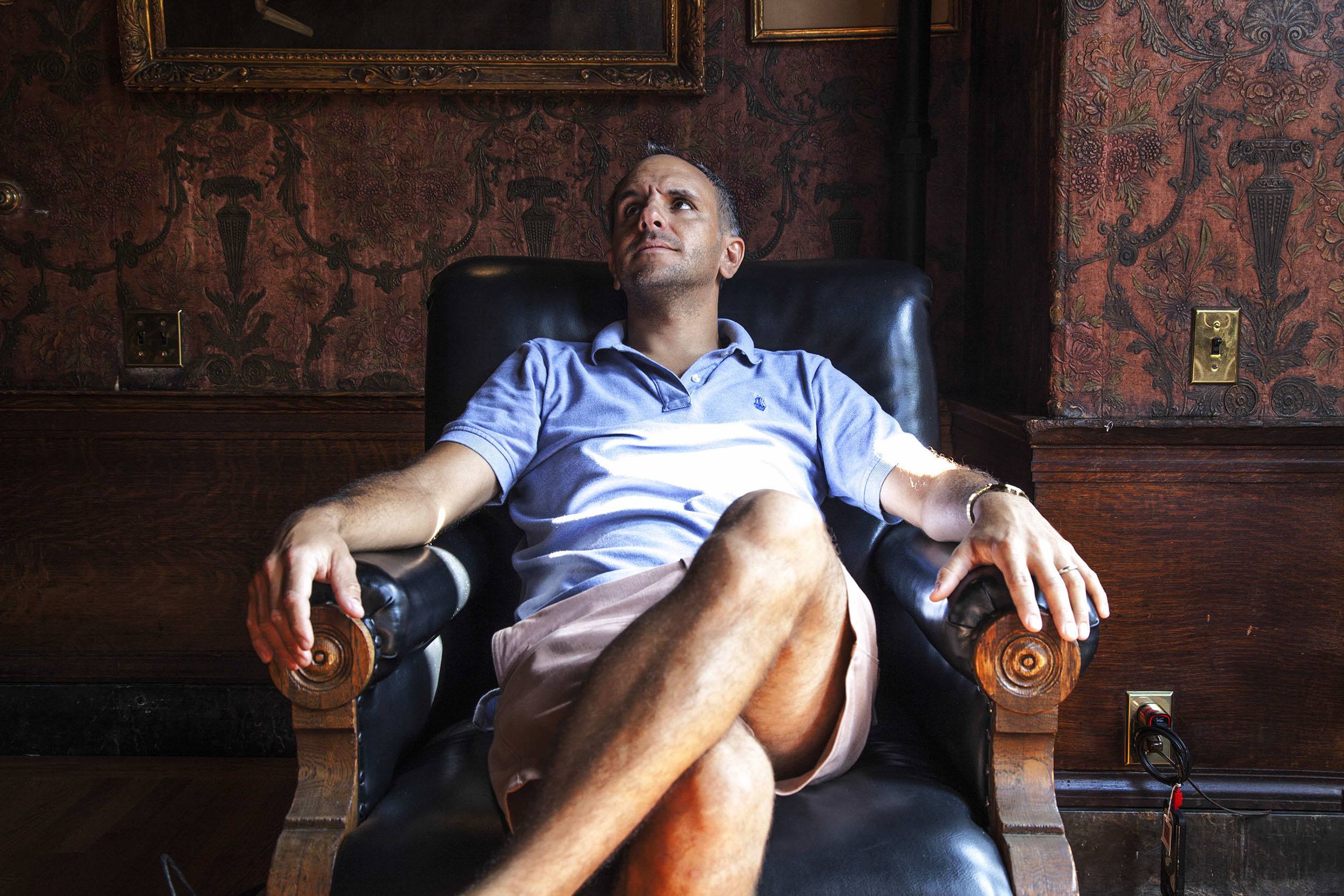 Matthew in leather chair Algonquin Club Boston USA