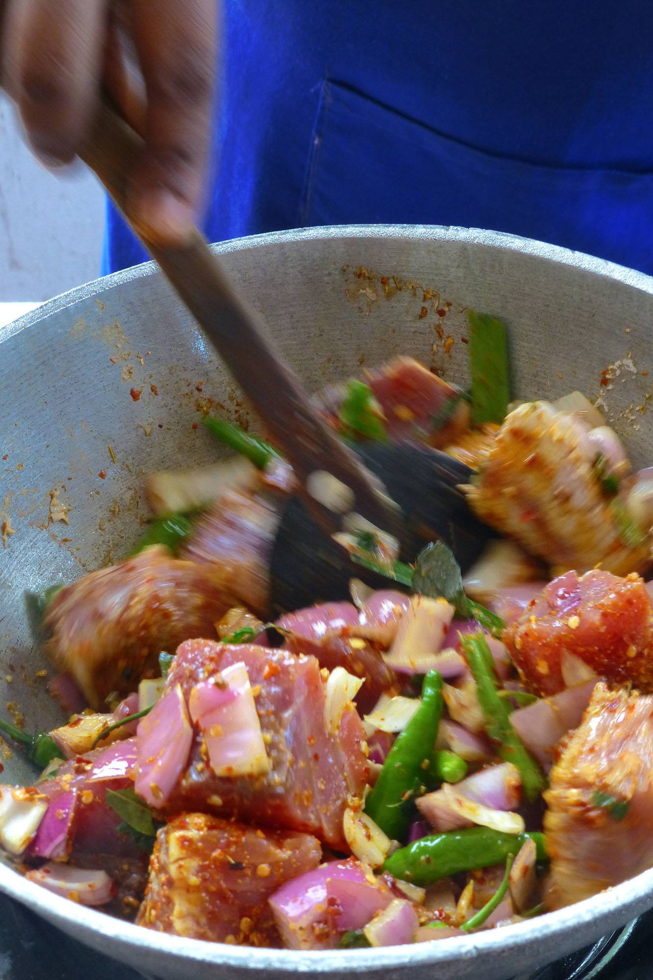 Mixing ingredients in bowl in Kiruna's kitchen Unawatuna Sri Lanka