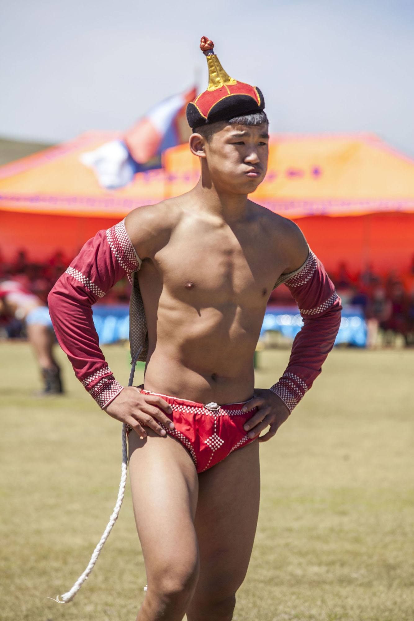 Mongolian wrestler with tired face after wrestling