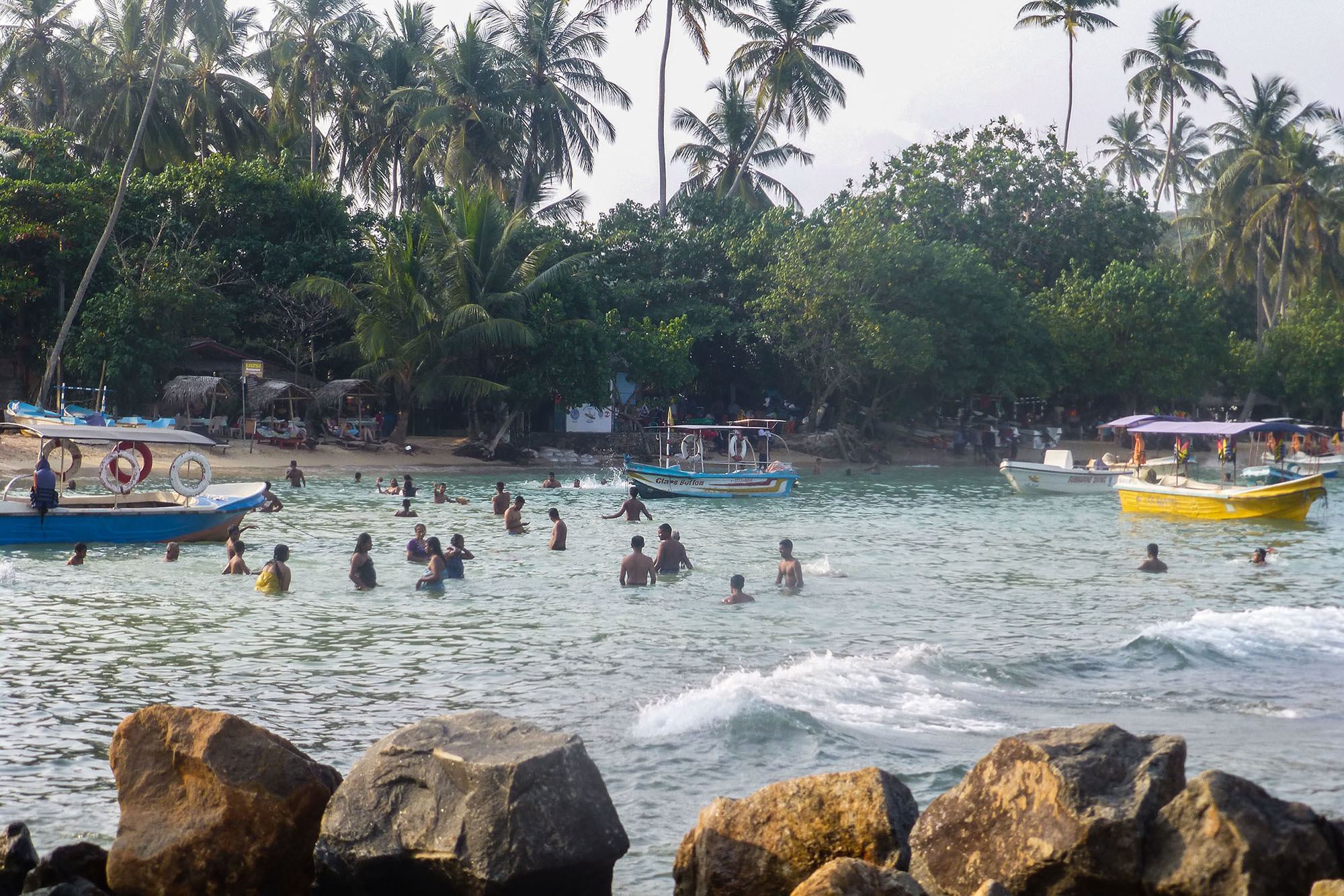 people swimming at Unawatuna beach Sri Lanka