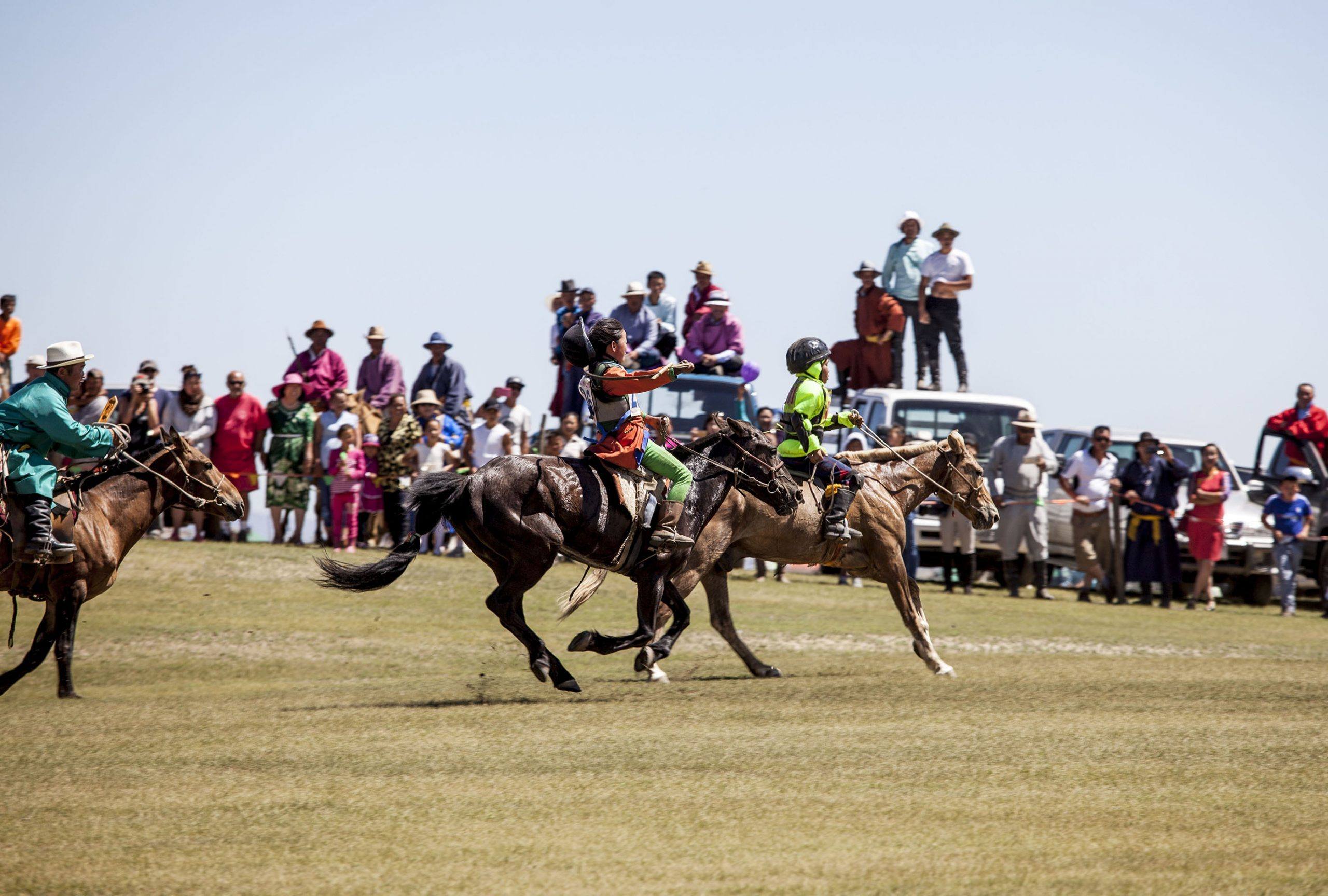 young Mongolian riders horse racing at Naadam