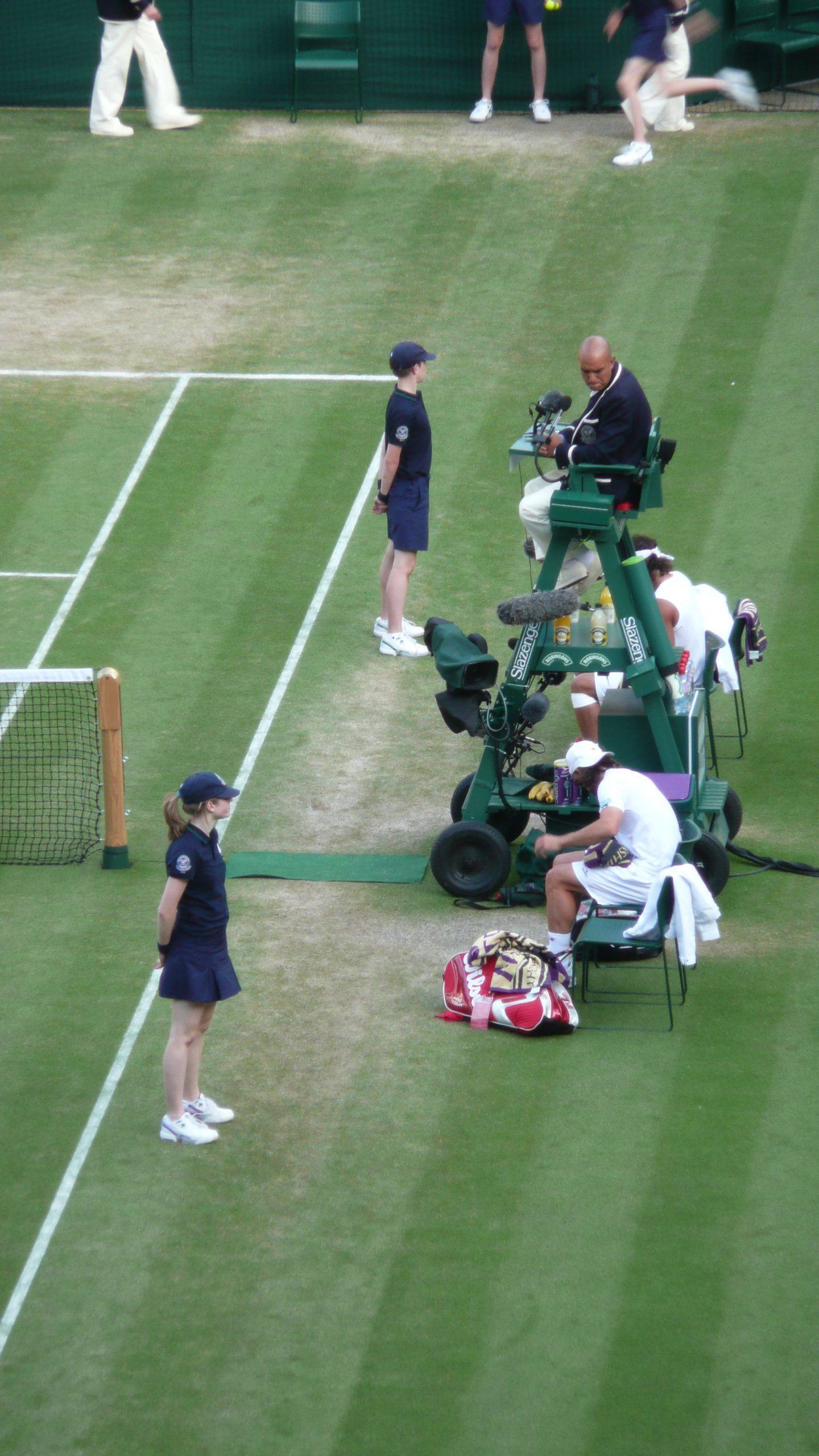 Ball boys and girls working in Centre Court at Wimbledon London England United Kingdom