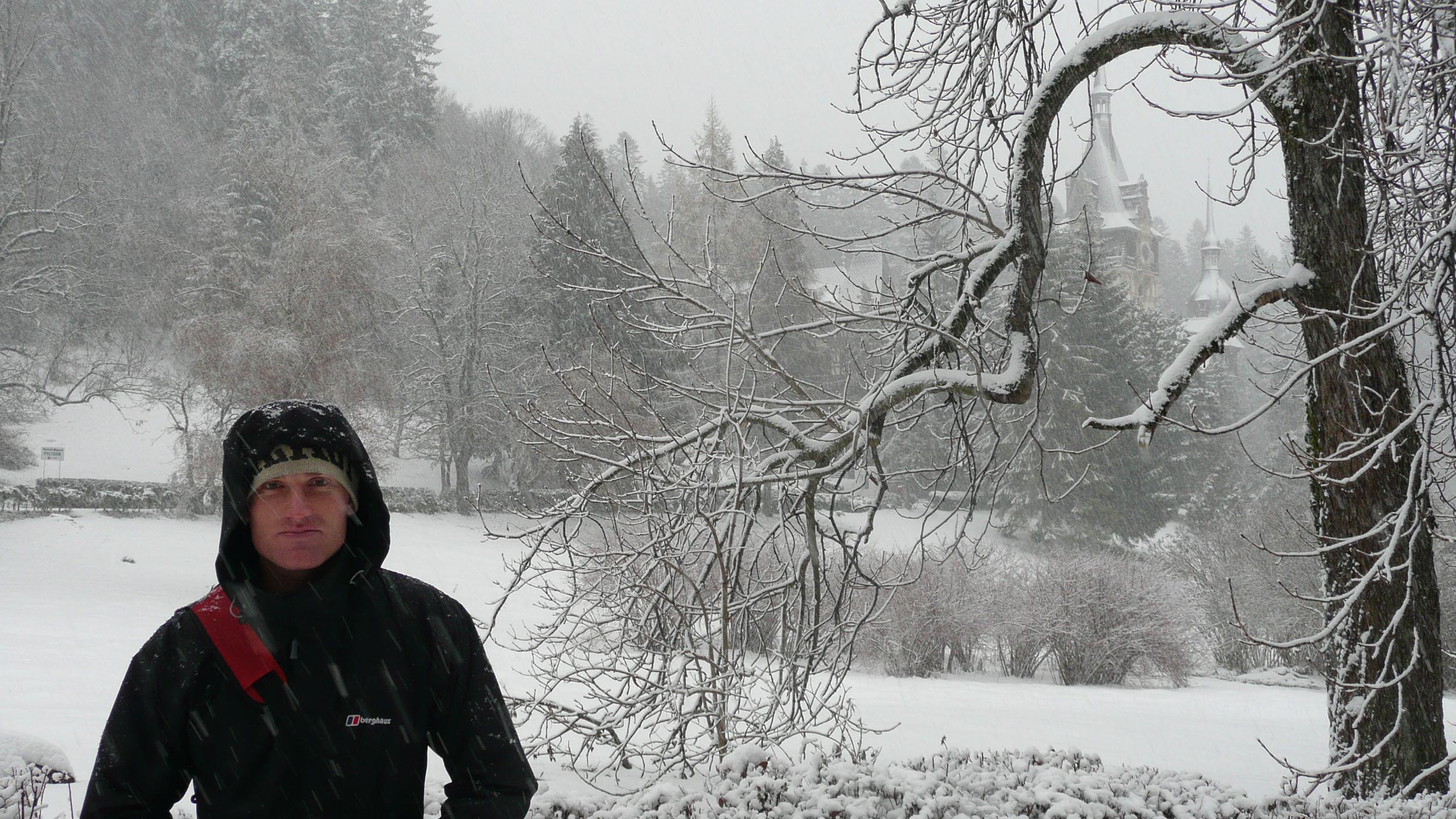 Ben King posing outside Peles Castle in Romania