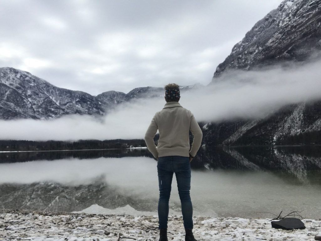 Ben admiring Bohinj Lake covered in mist Slovenia