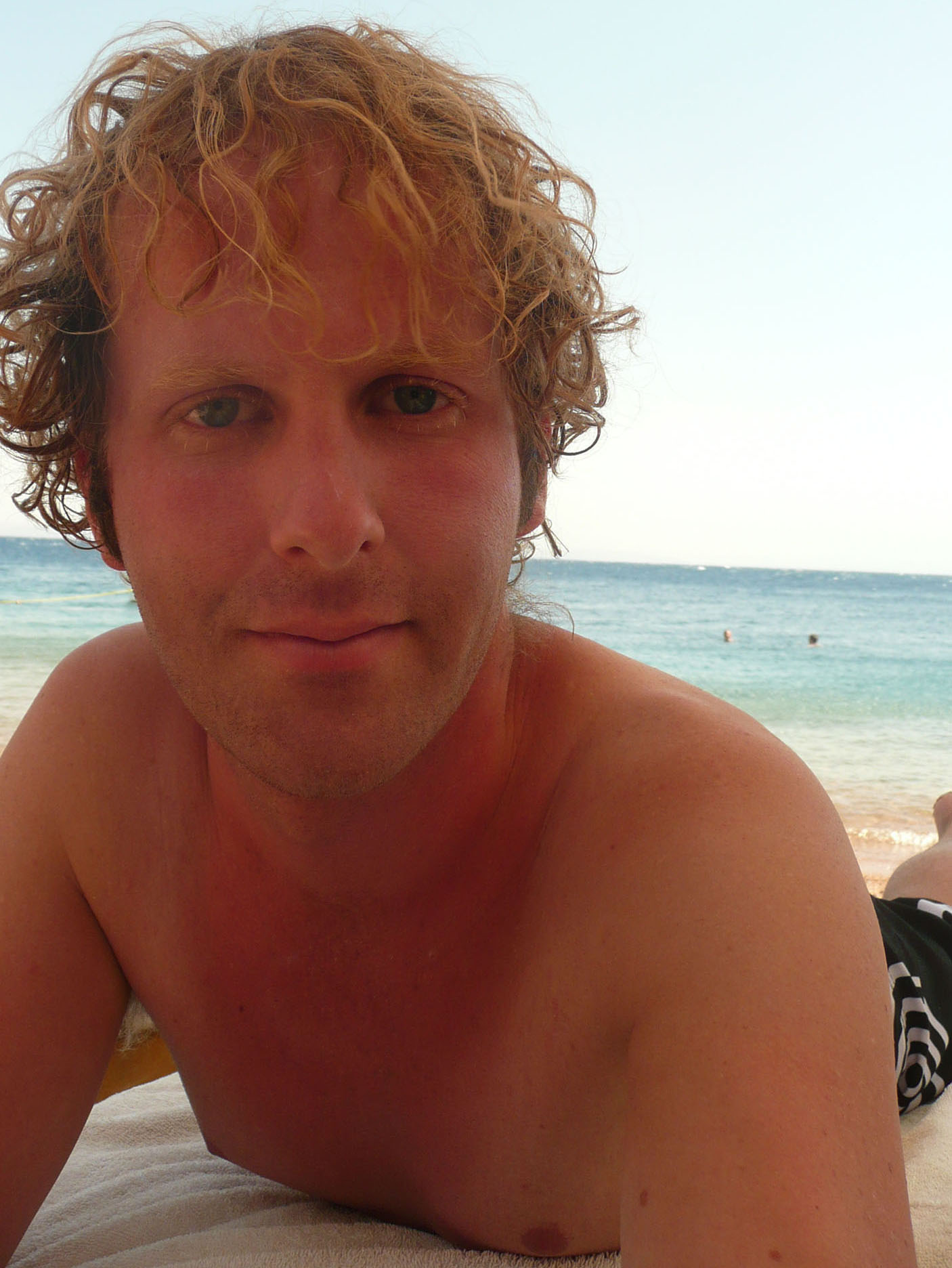 Ben laying on a beach in Dahab Egypt