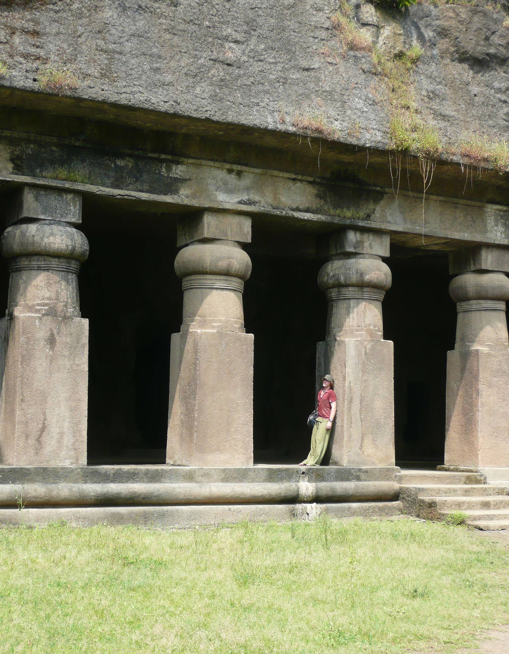 Ben leaning against column of building on Elephanta Island Mumbai India