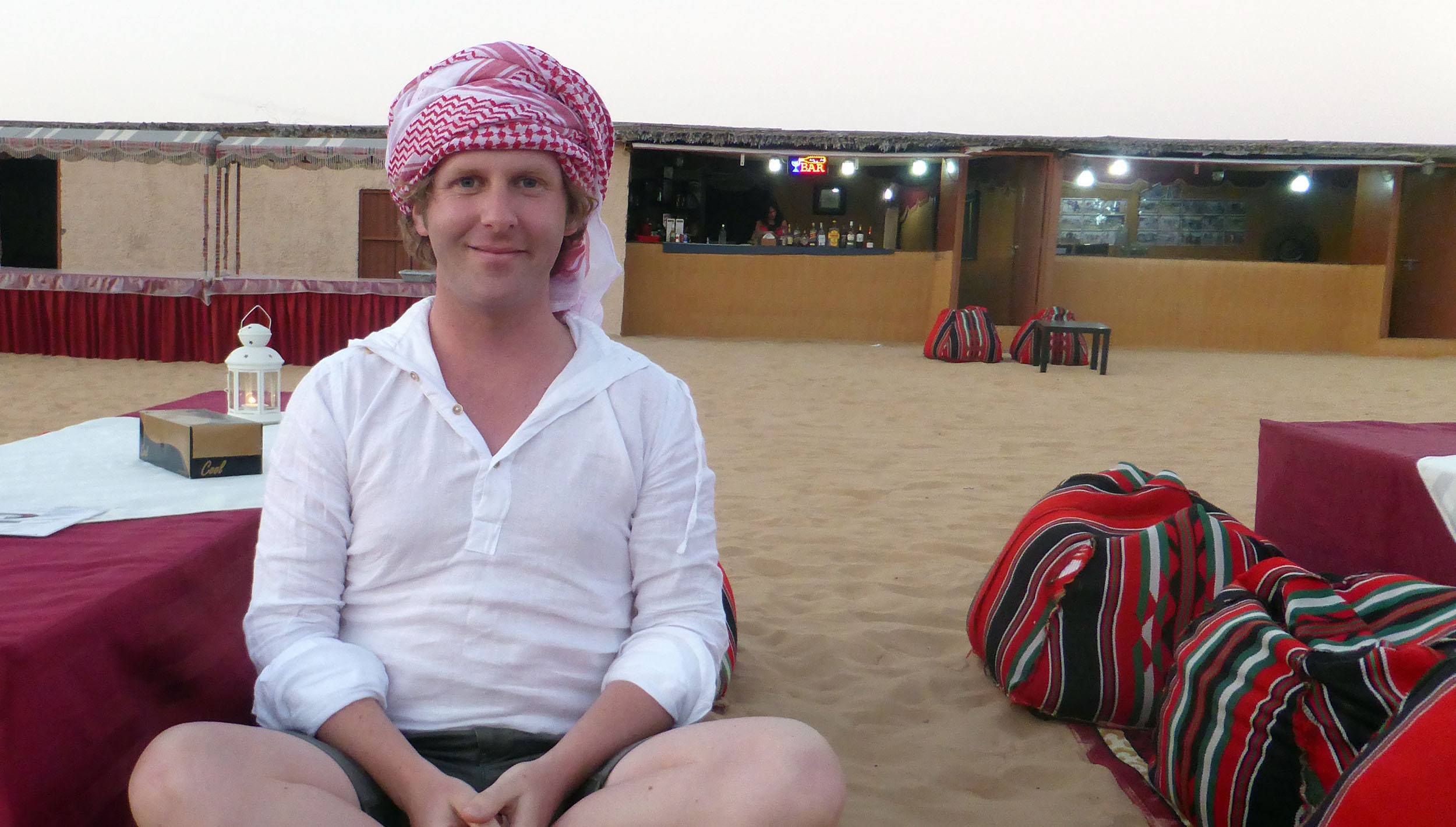 Ben sitting at table in bedouin camp near Dubai United Arab Emirates