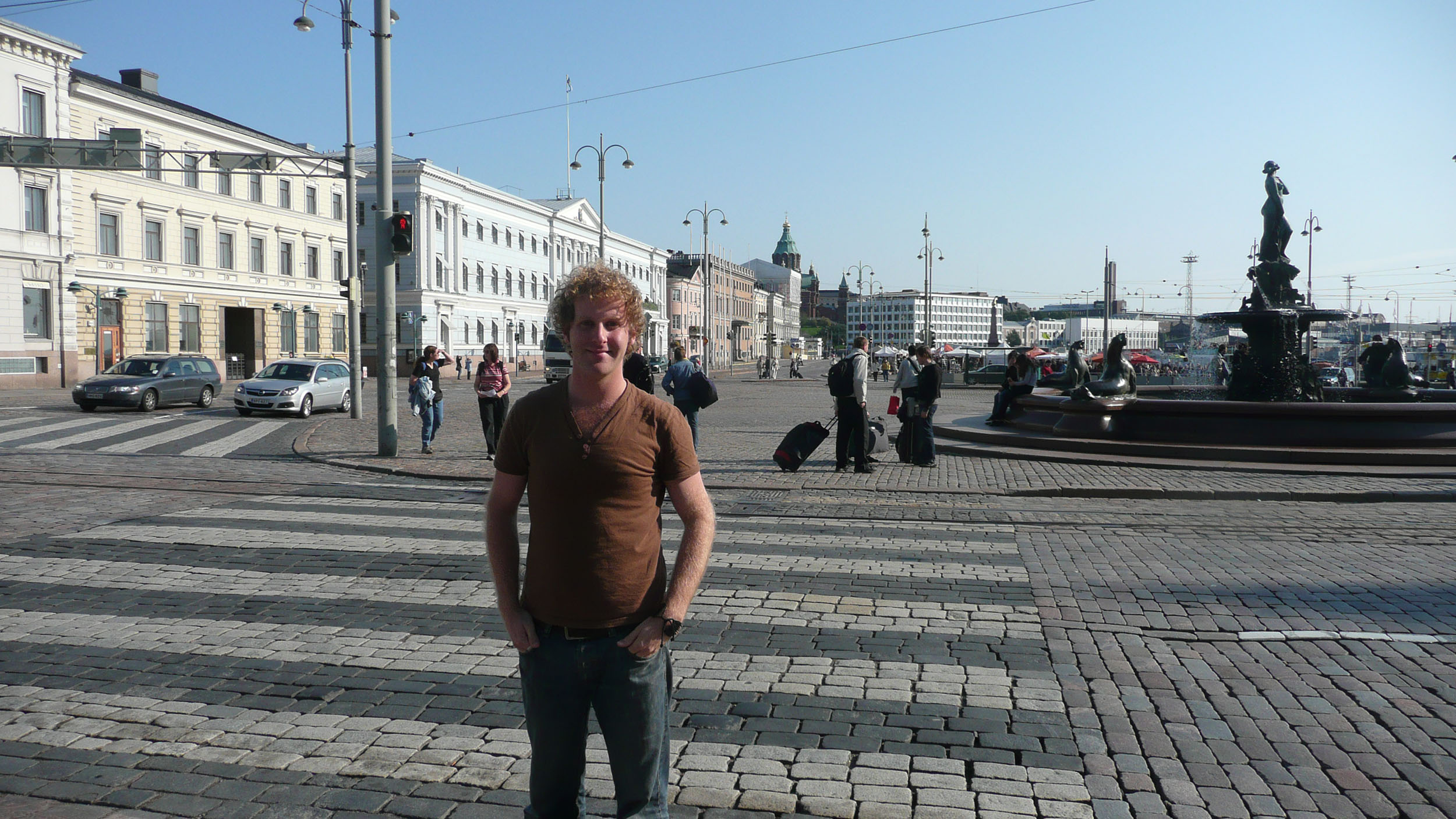 Ben standing in Market Square in Helsinki Finland