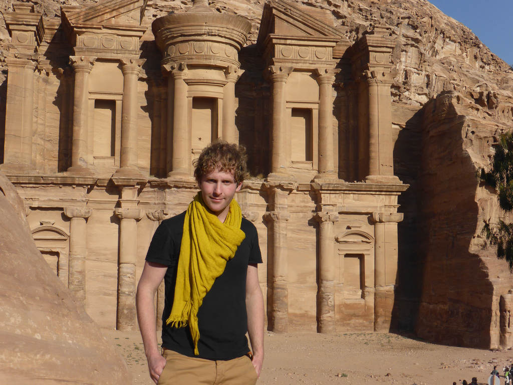 Ben standing in front of The Monastery in Petra Jordan