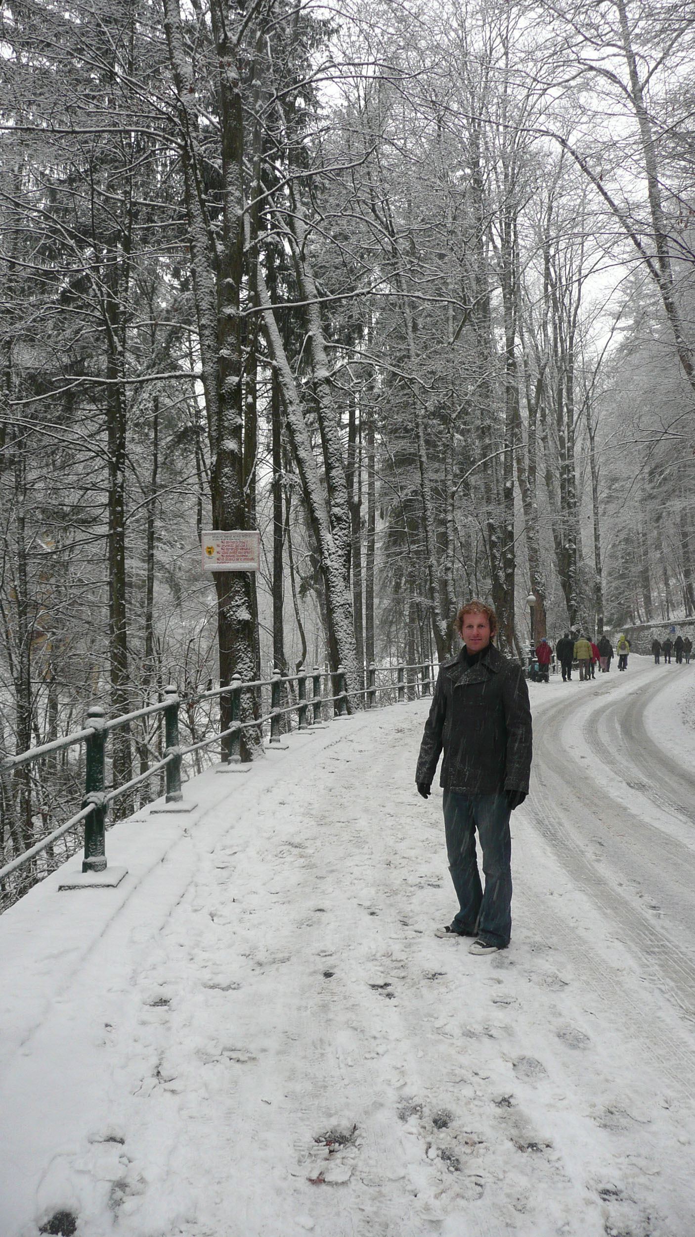 Ben standing in snow en route to Peles Castle Romania