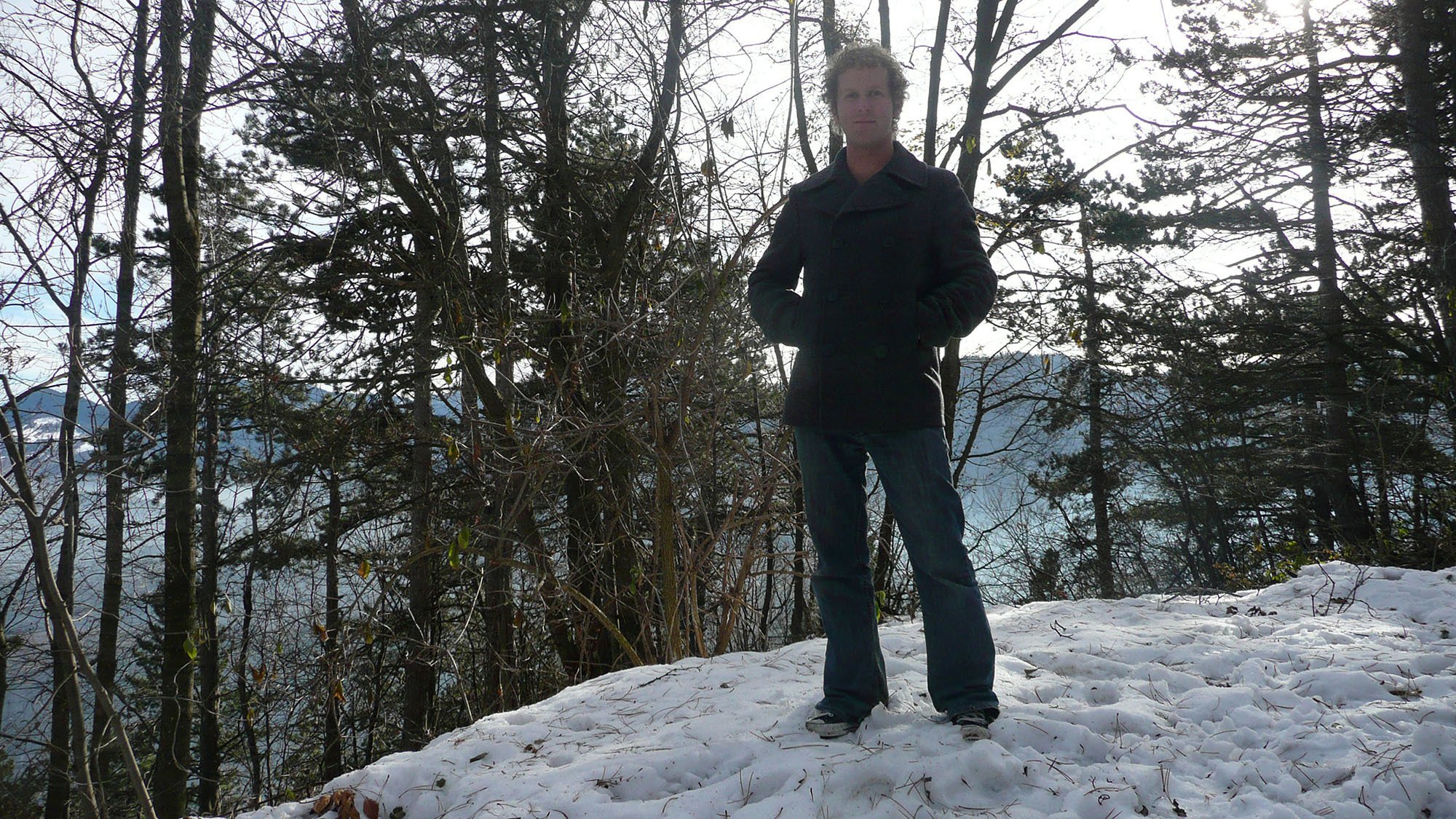 Ben standing in snow on Mount Tampa in Brasov Romania