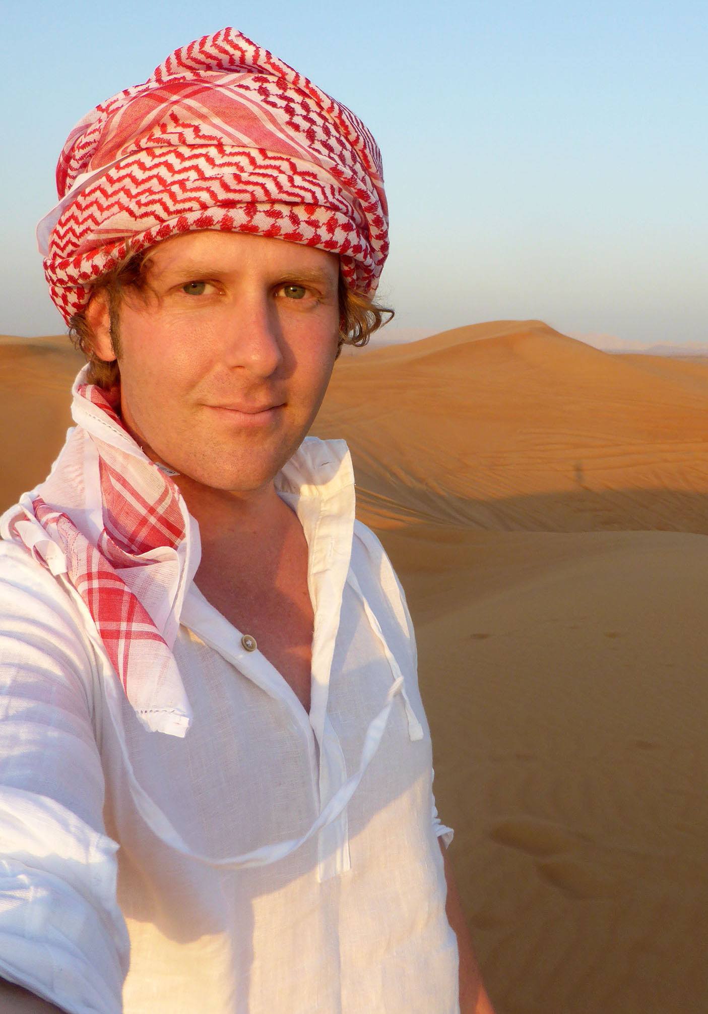 Ben wearing turban in sand dunes near Dubai United Arab Emirates