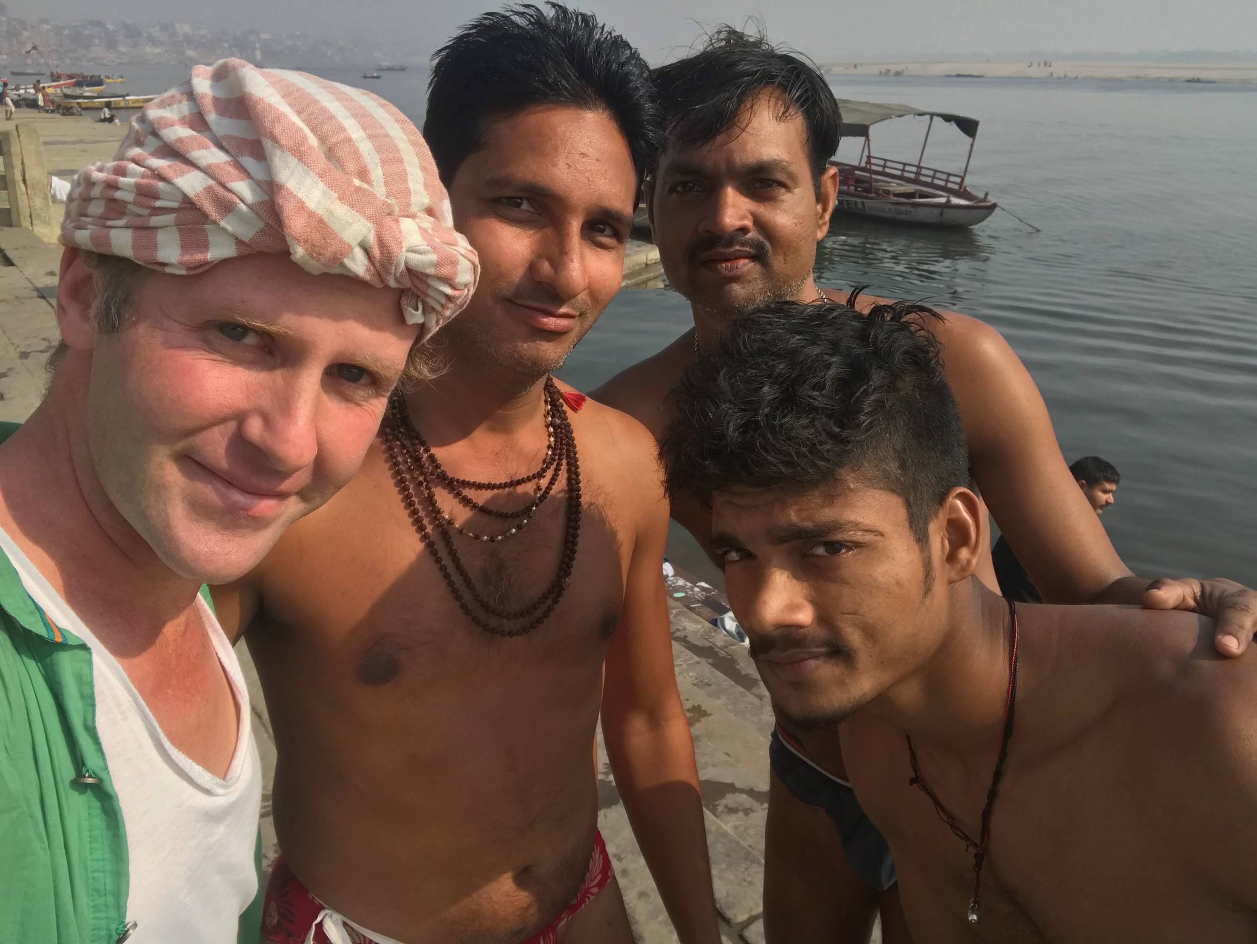 Ben with Indian men by the Ganges in Varanasi India