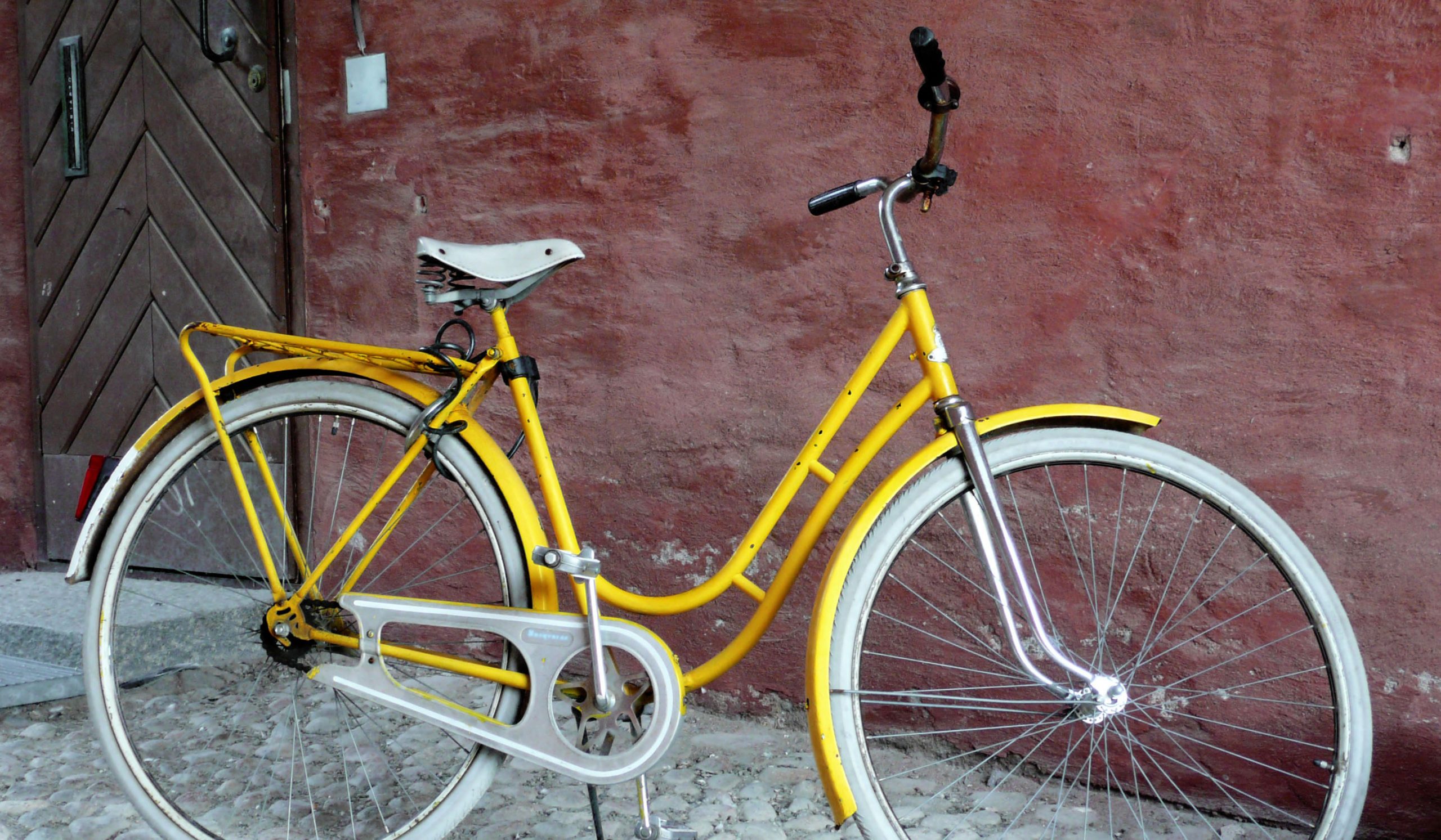 Bicycle leaning against wall of building on Suomenlinna in Helsinki Finland