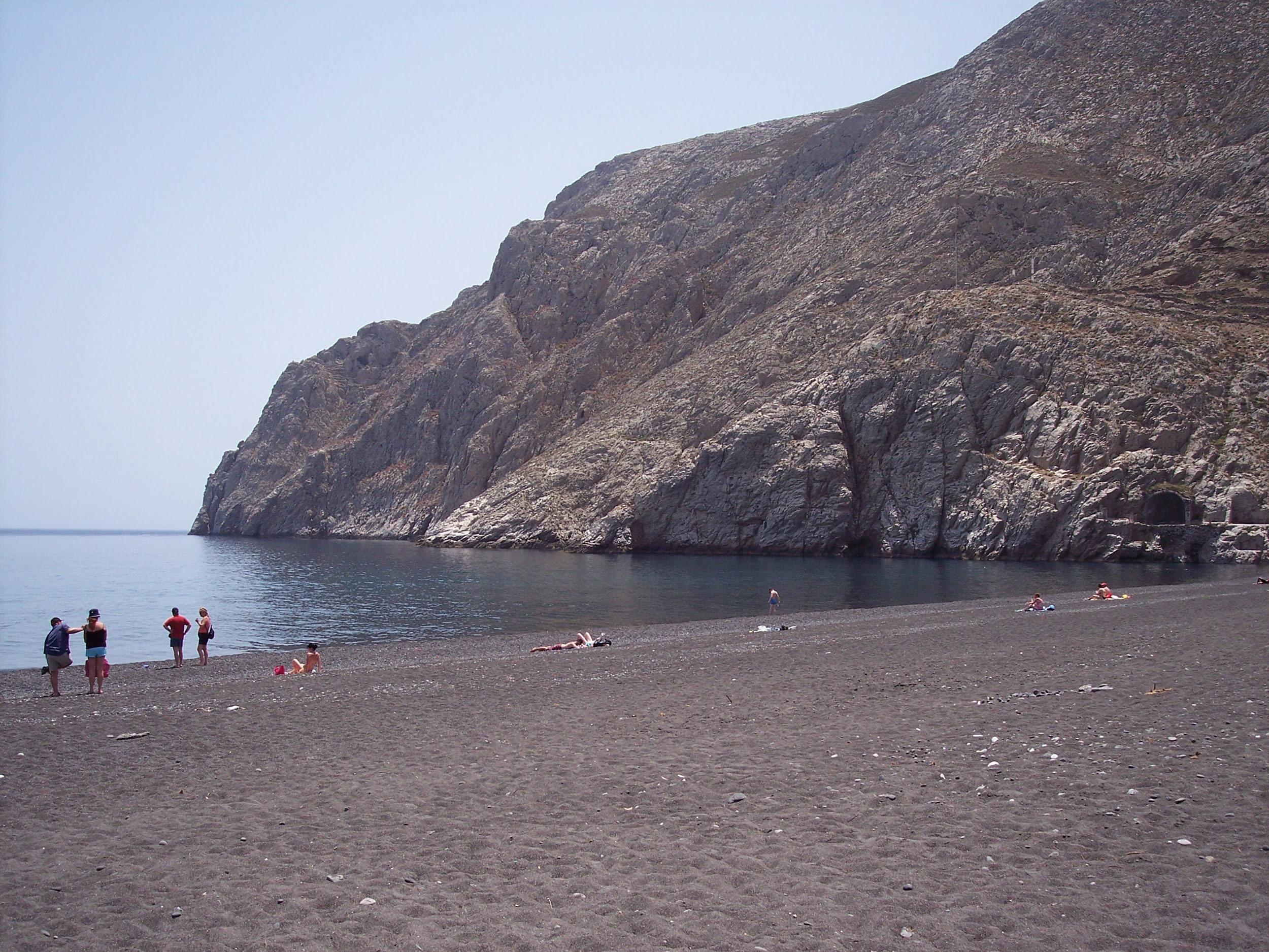 Black volcanic sand beach on Santorini in Greece