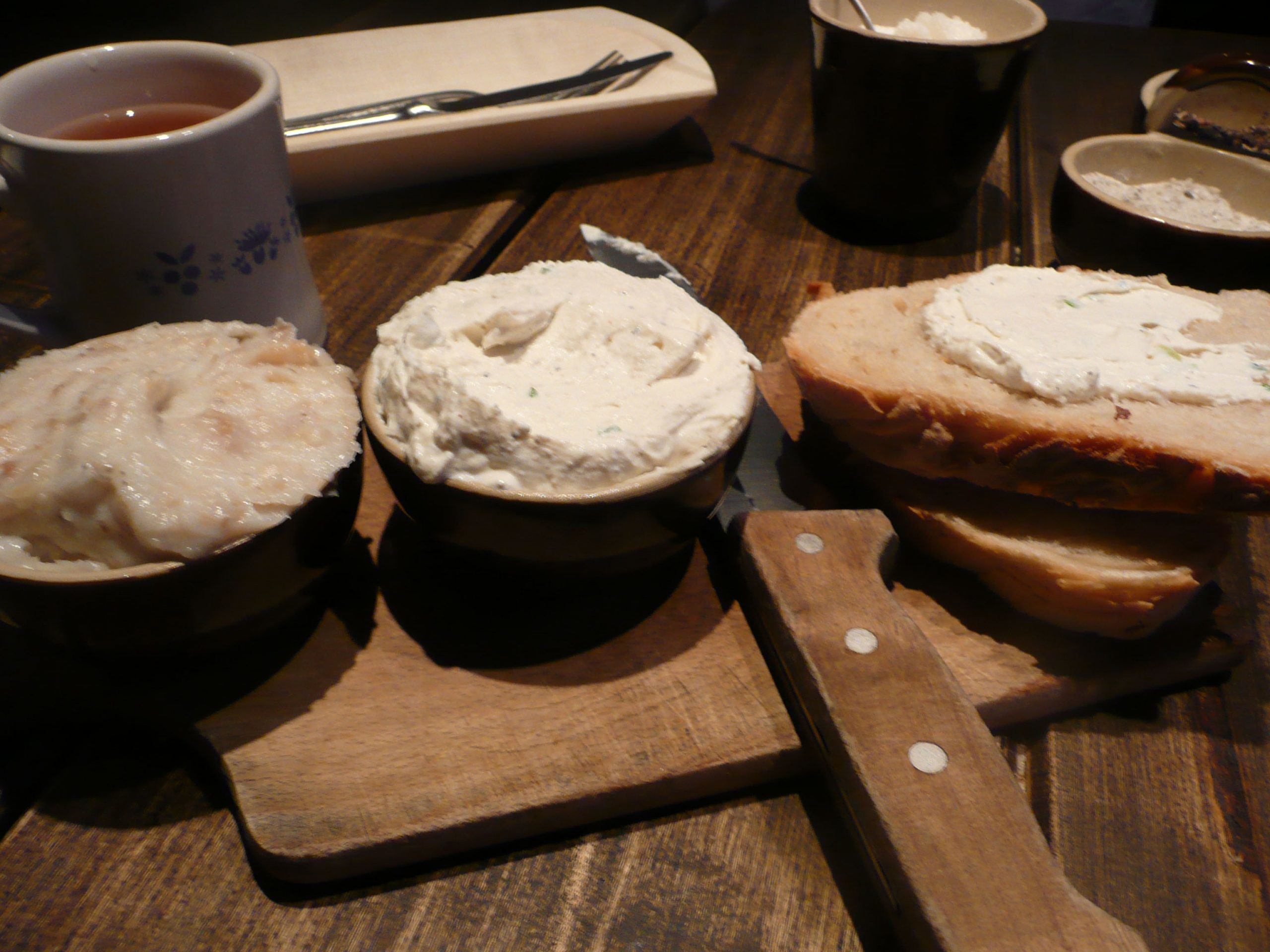 Bread and cheese served on a wooden board in a Polish restaurant in Krakow