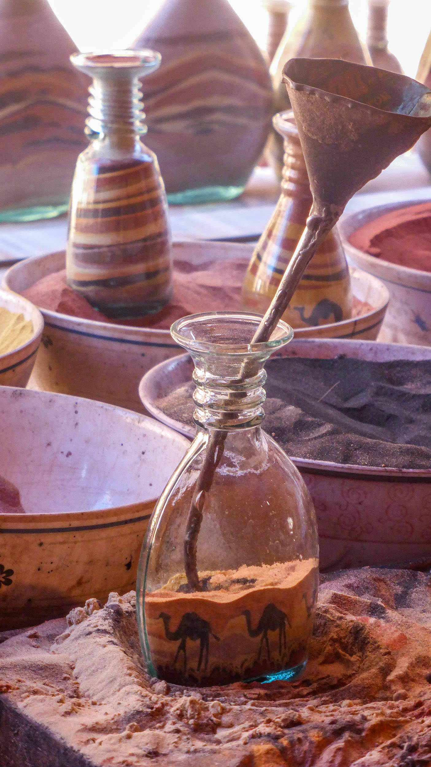 Colourful sand inside glass jars in Petra Jordan