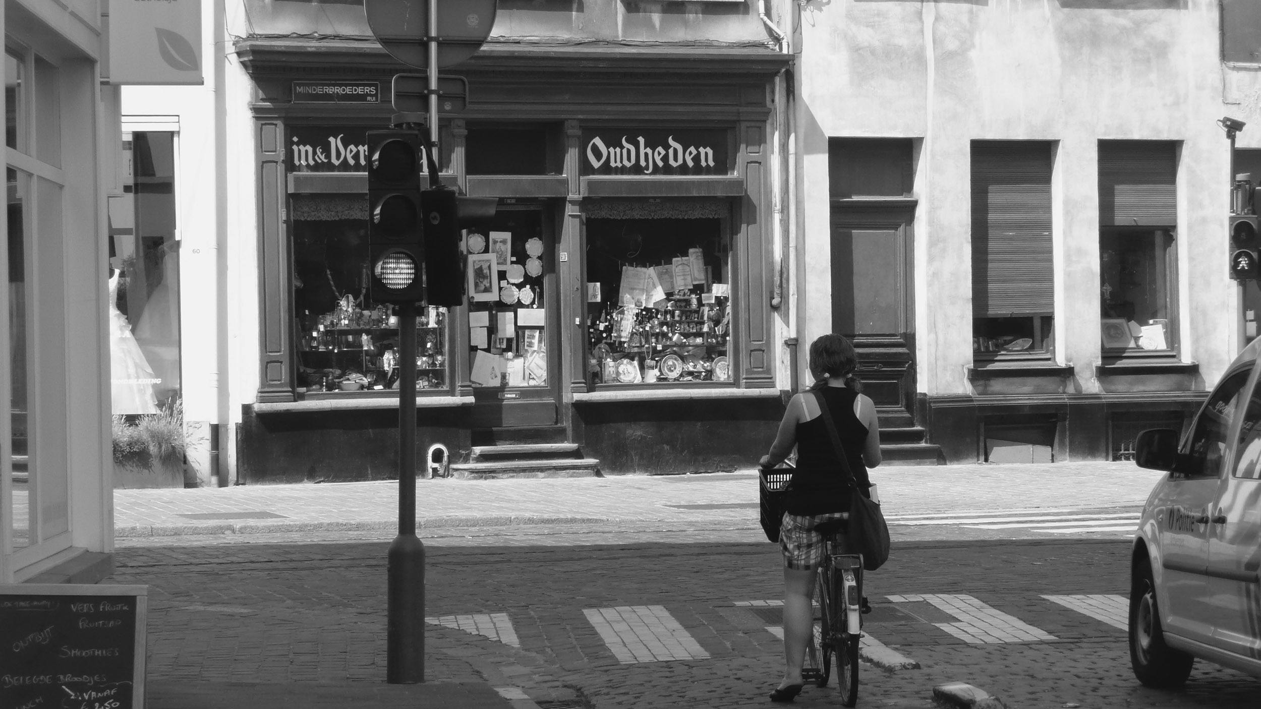 Cyclist riding through streets of Antwerp Beligum