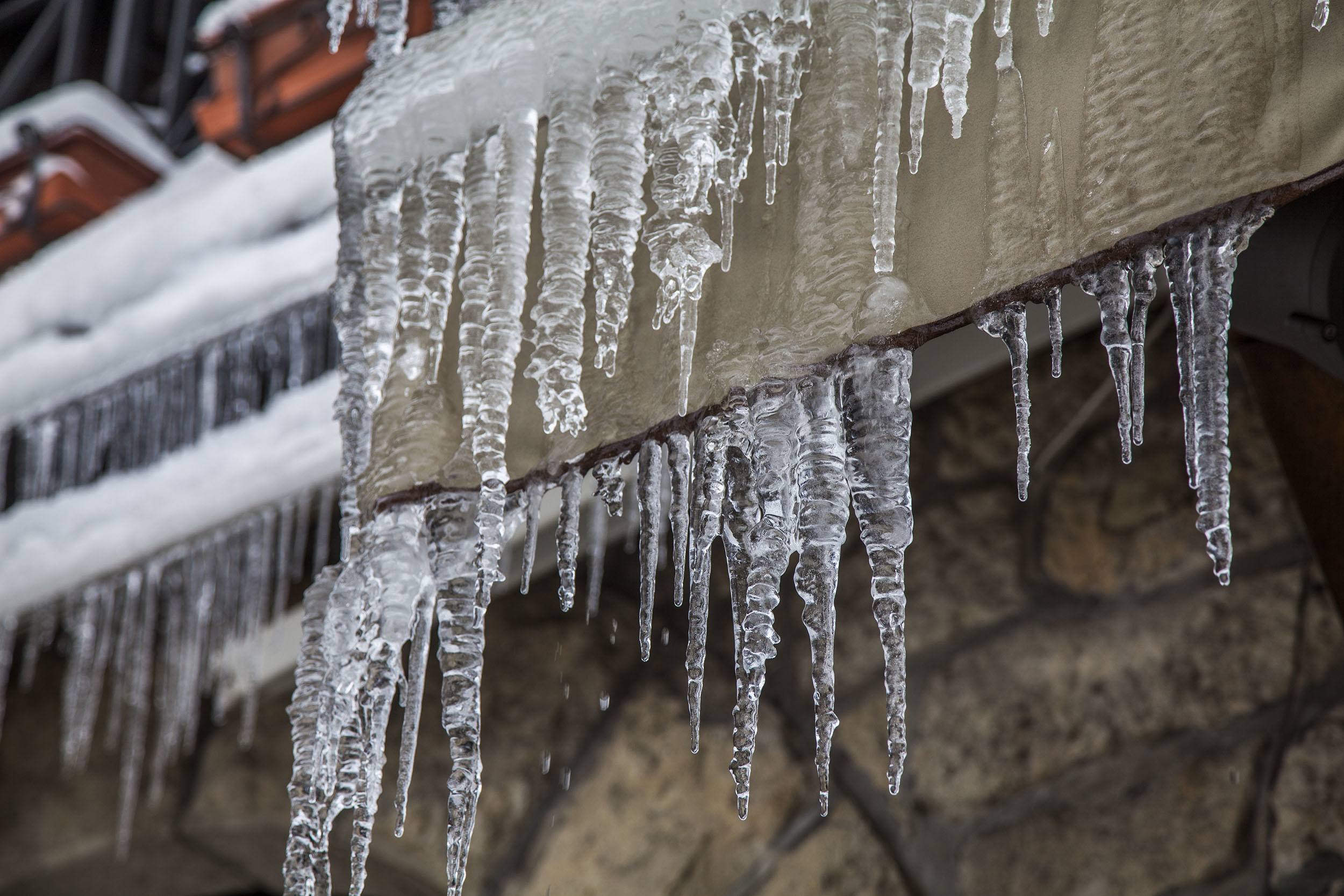 Icicles hanging from a building during winter in San Marino