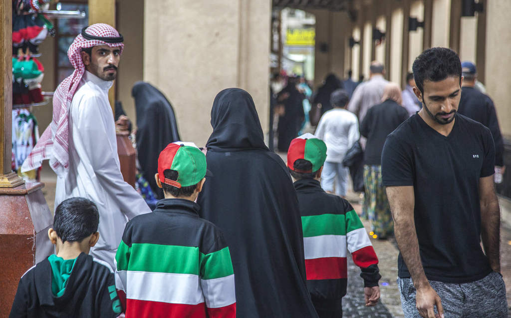 Kuwaiti family inside Souq Al-Mubarakiya on Kuwait National Day