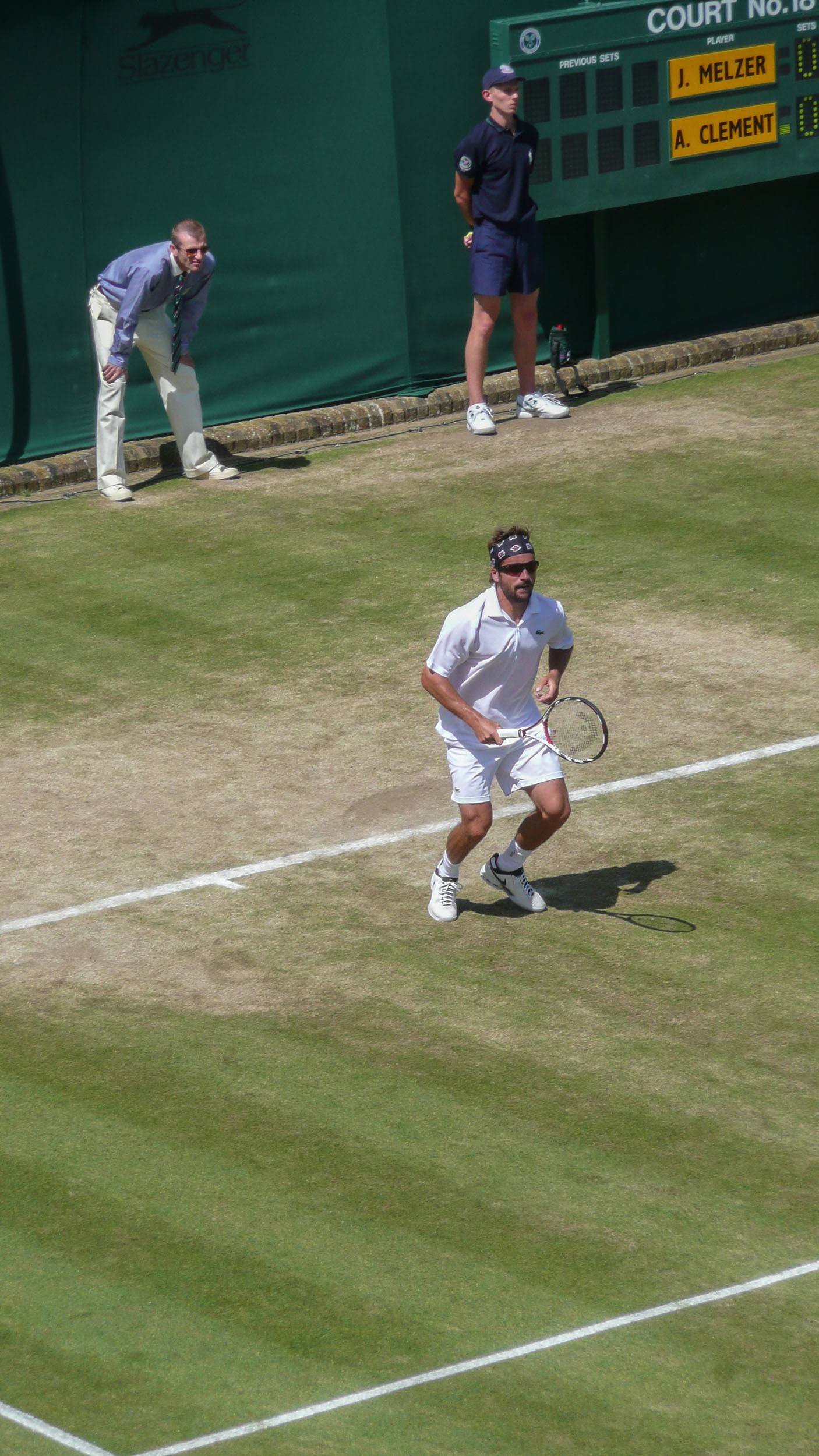 Male tennis player on a Wimbledon court anticipating serve London England United Kingdom