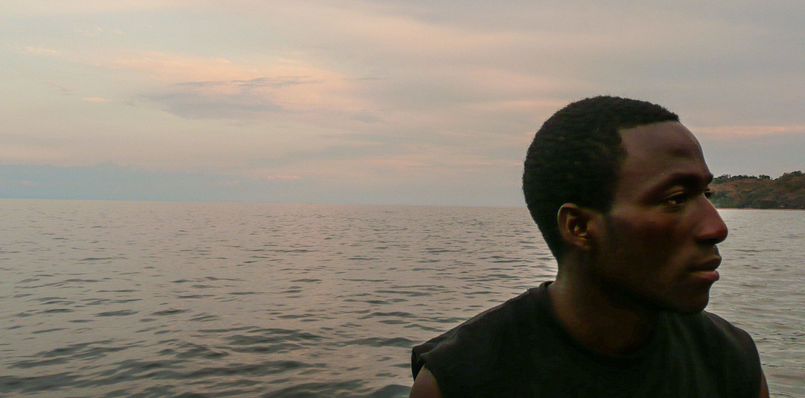 Man in boat on Lake Malawi near Nkhata Bay Malawi