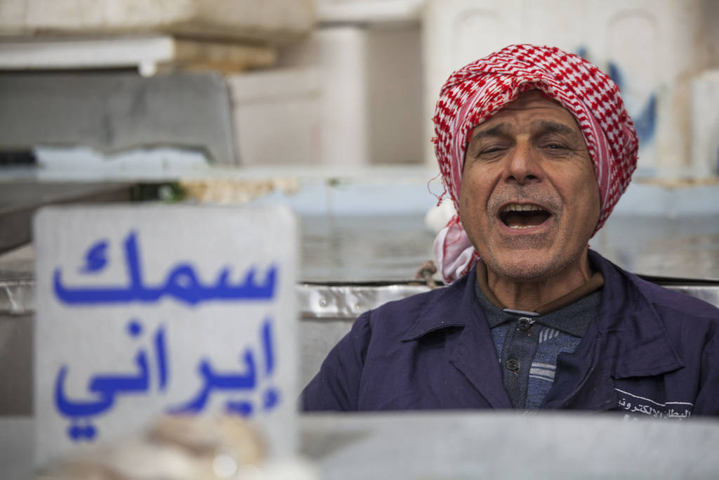 Man laughing at Central Fish Market in Kuwait