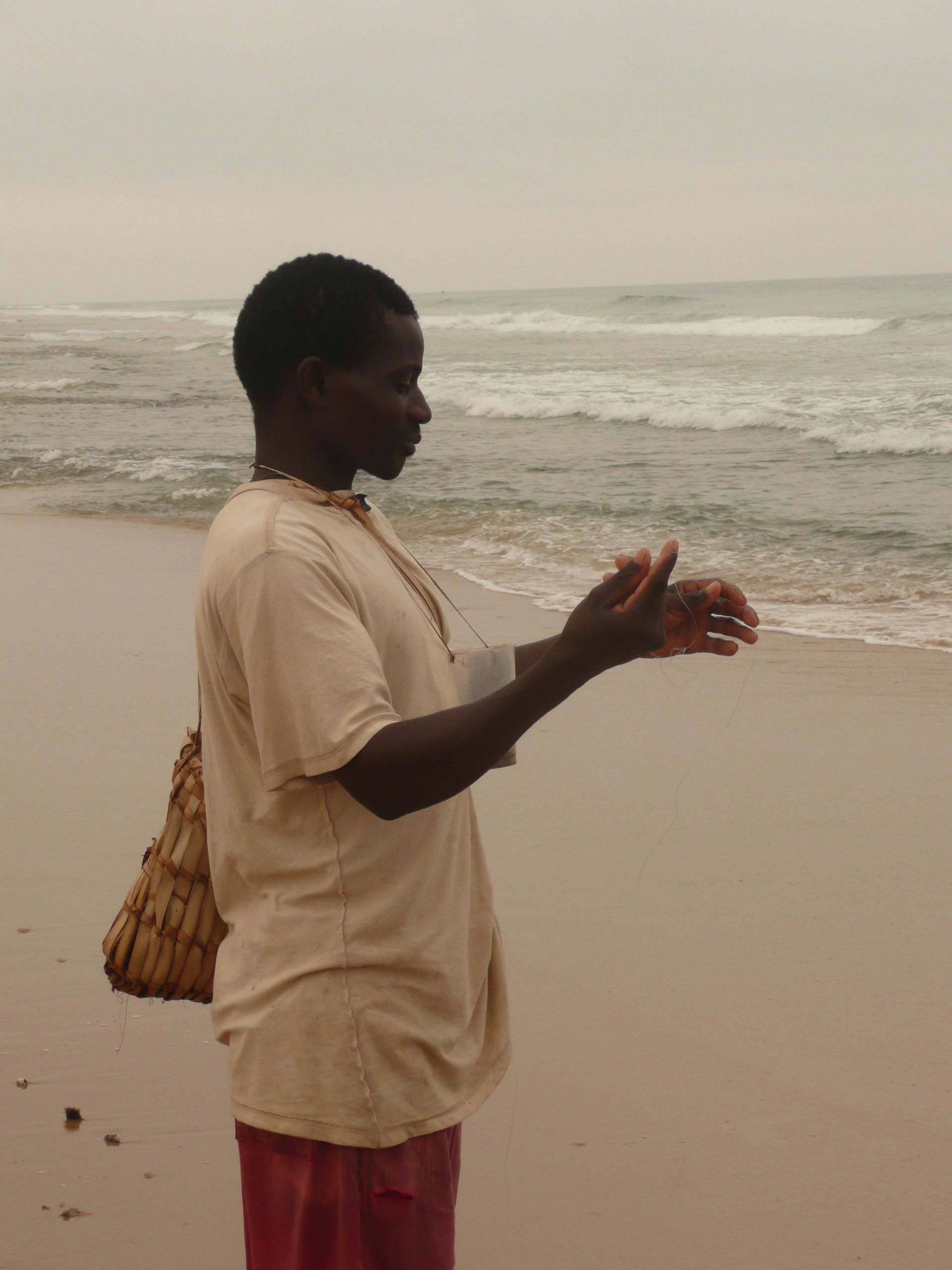 Man preparing to fish on Tofo Beach Mozambique