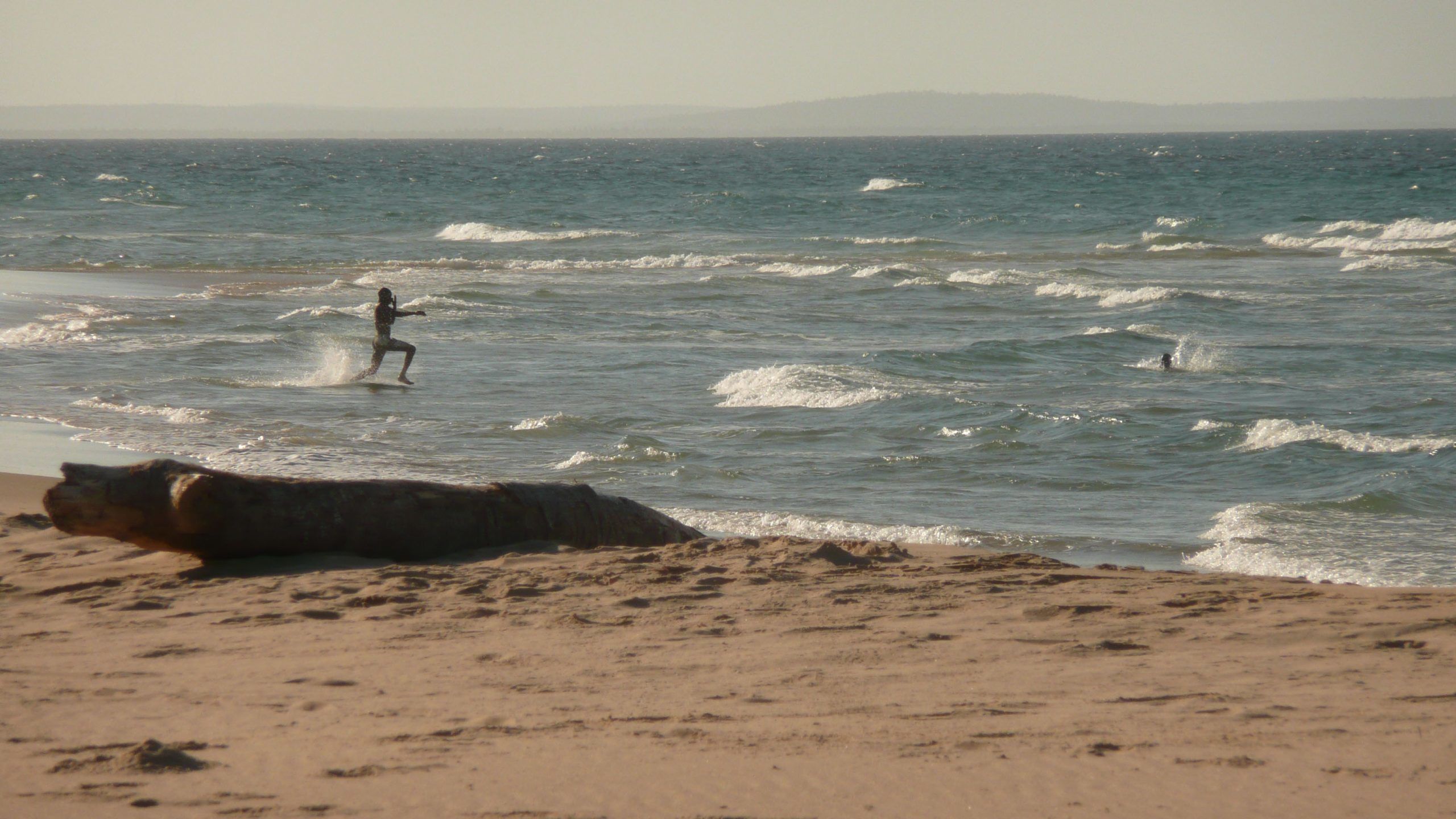 Man running into the ocean on Vilankulos Beach Vilankulos Mozambique