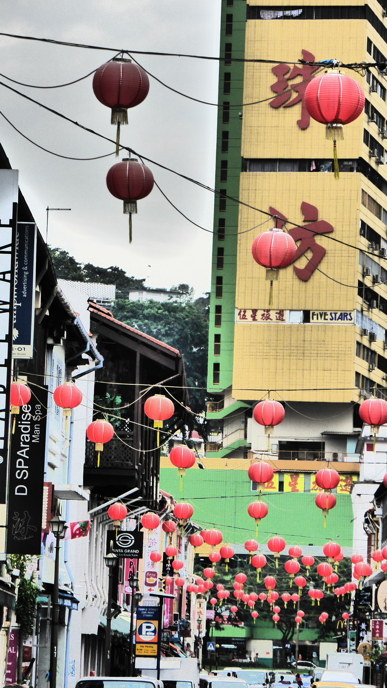 Many lanterns hanging in a street in Singapore