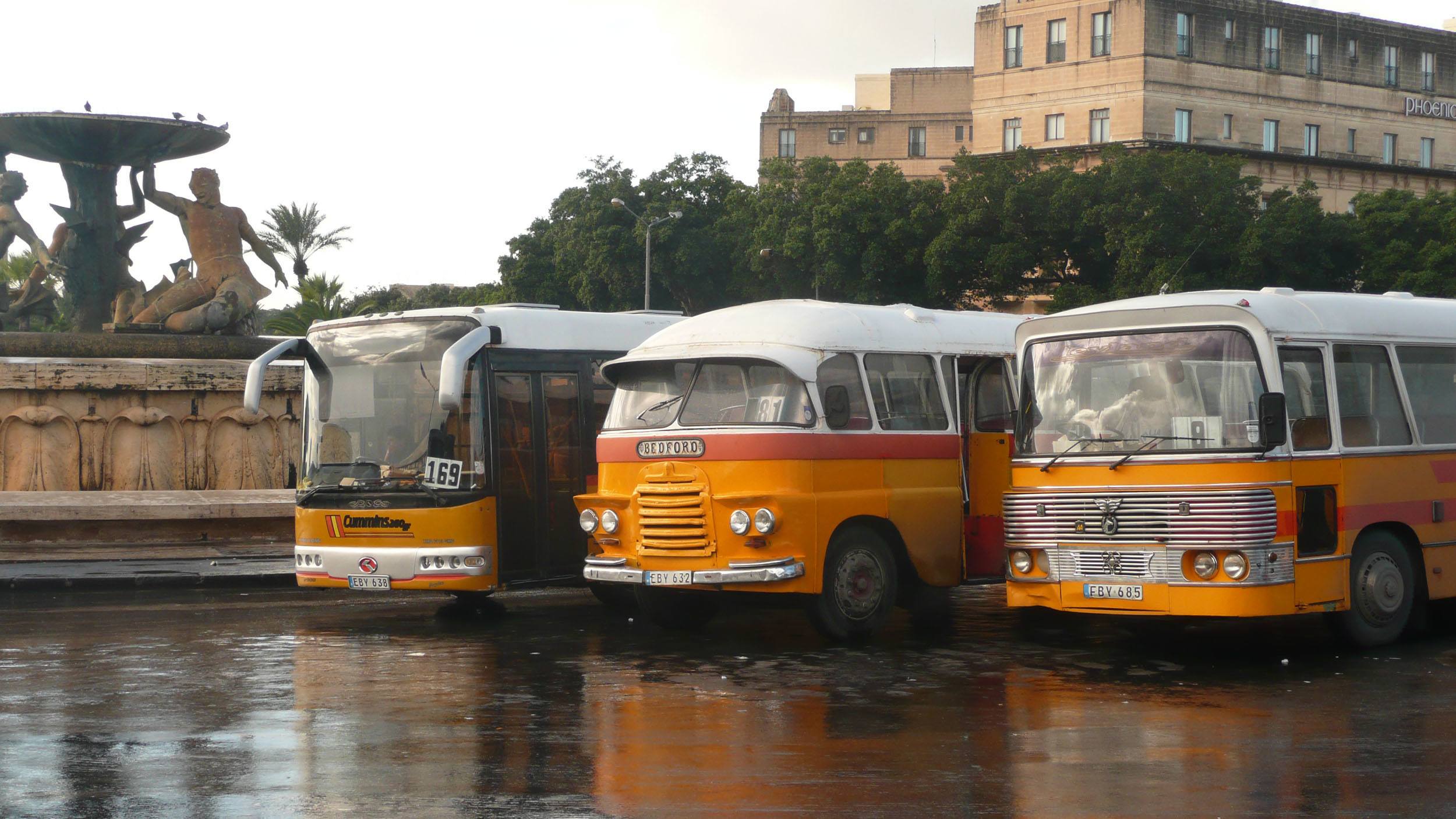 Orange public Maltese buses in Valletta Malta