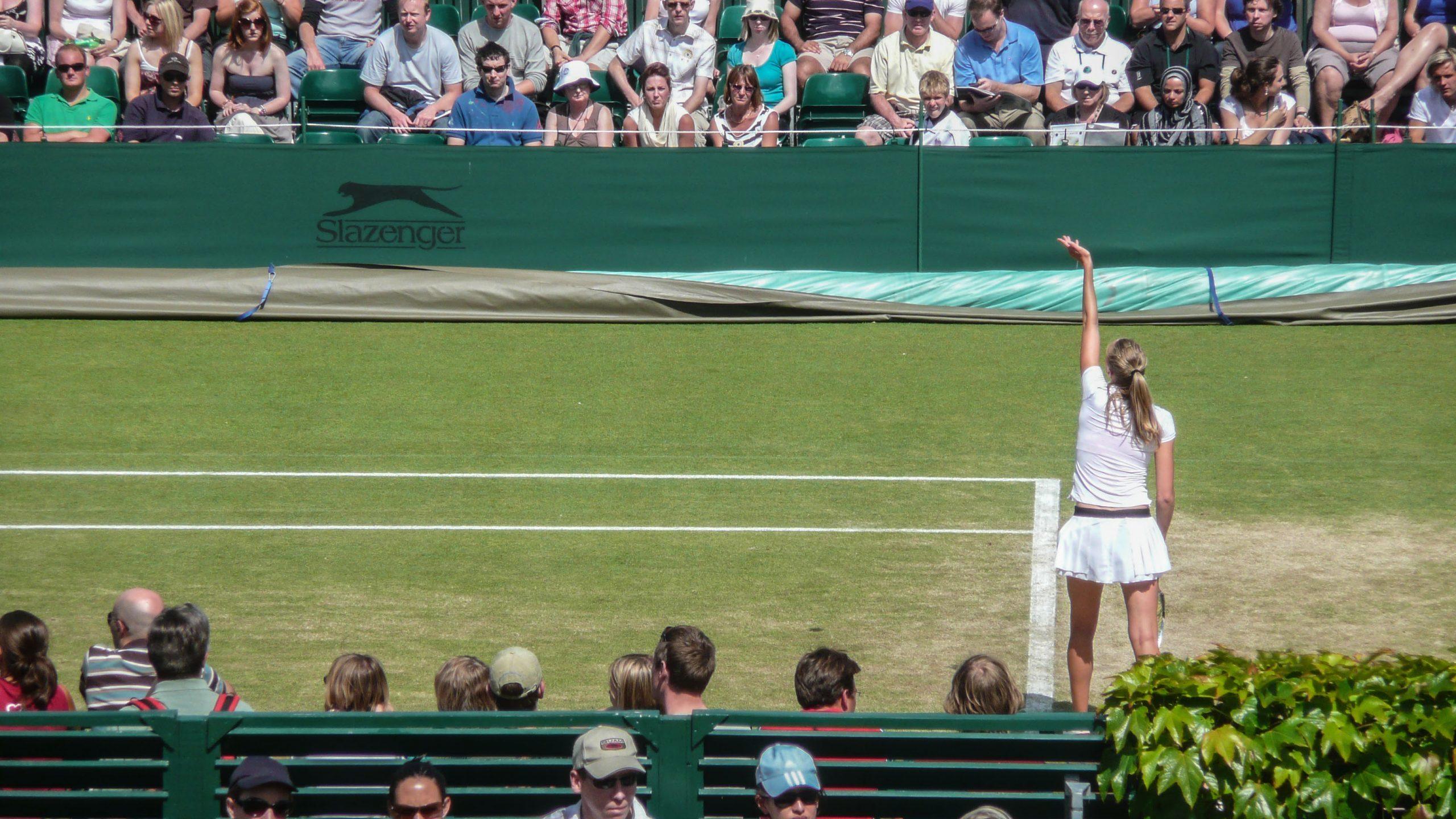 Professional female tennis player serving on an outer court at Wimbledon London England United Kingdom