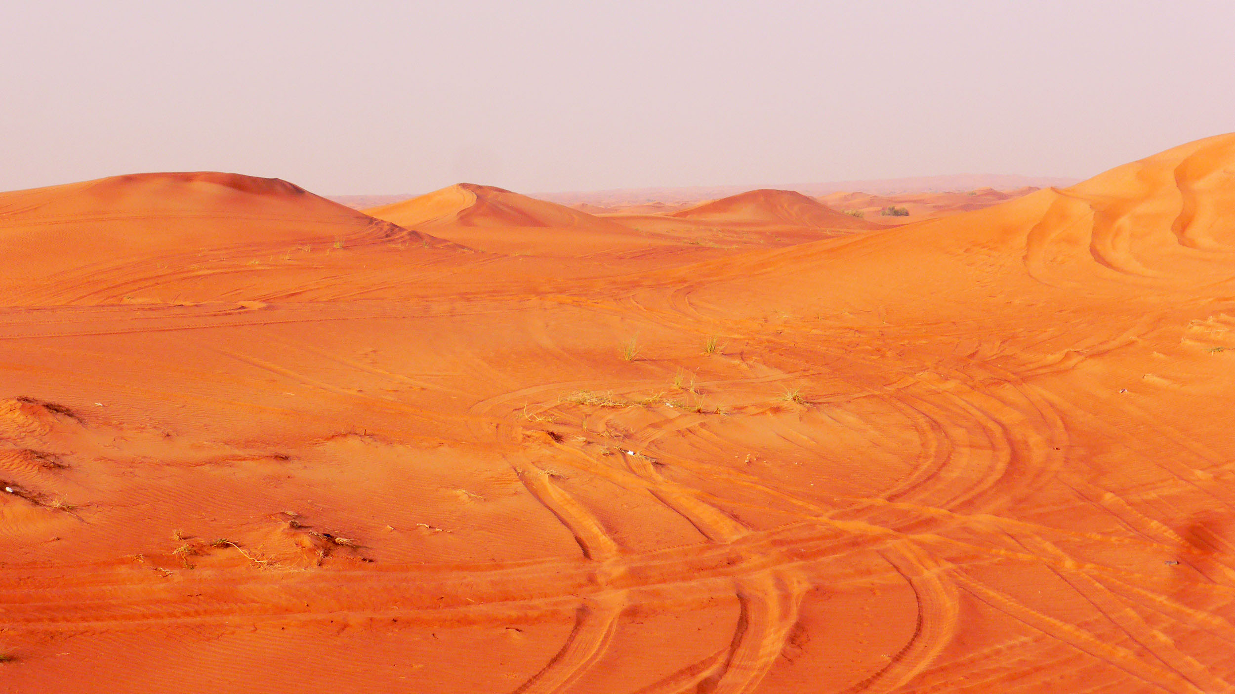 Sand dunes near Dubai with tyre tracks United Arab Emirates