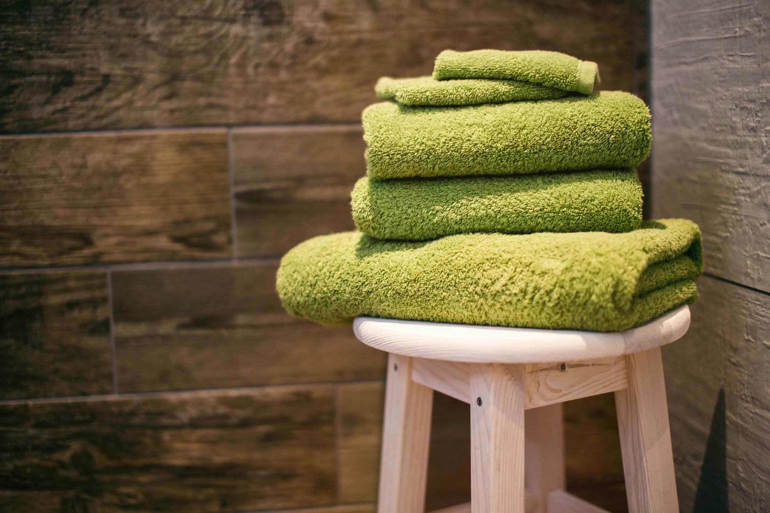 Towels on a stool in a bathroom