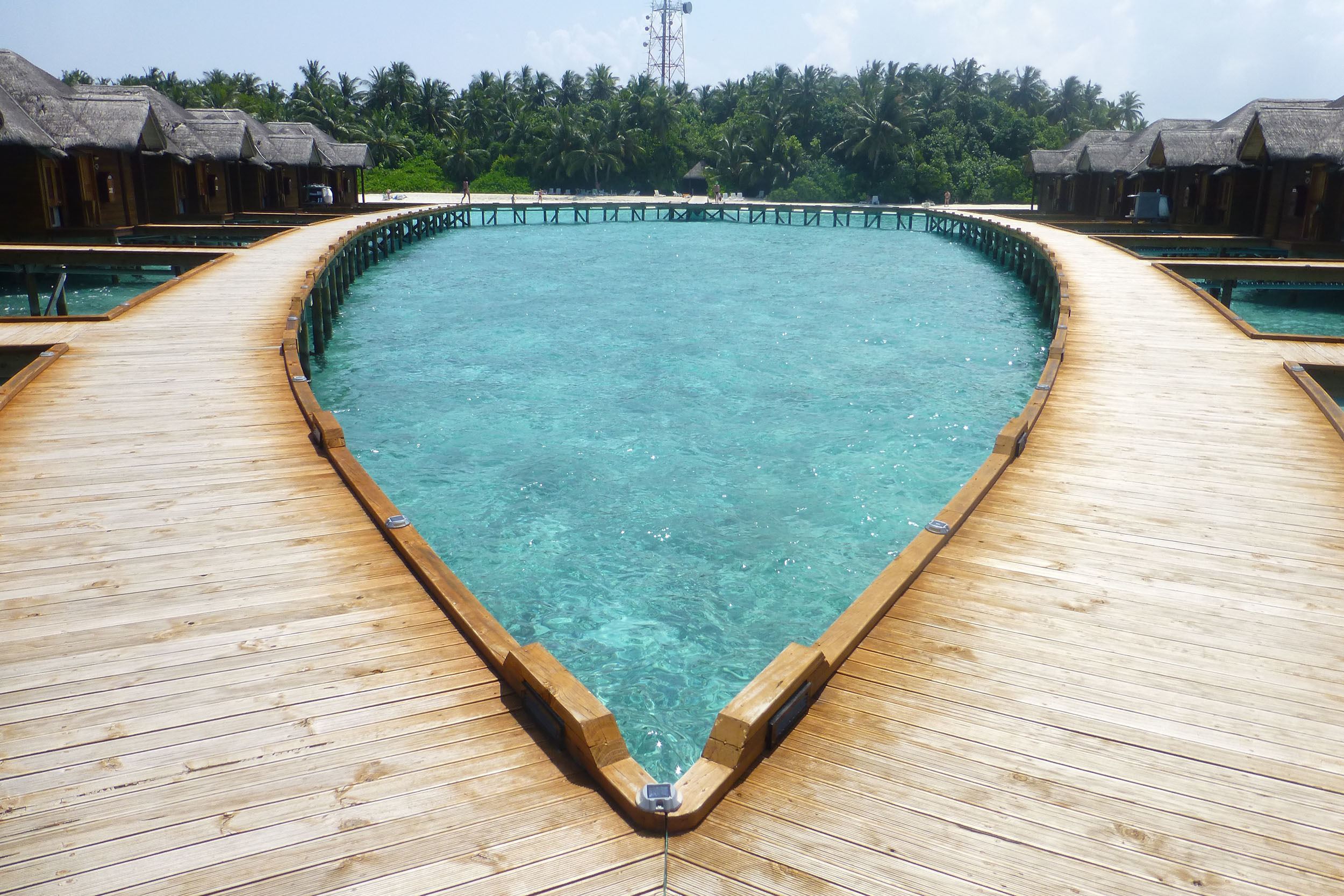 Walkway to overwater bungalows on Fihalhohi the Maldives