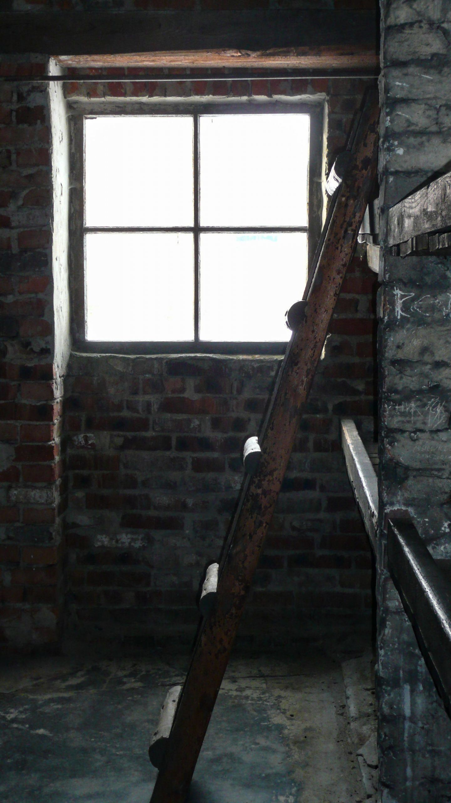 Wooden step ladder inside room at Birkenau concentration camp in Poland