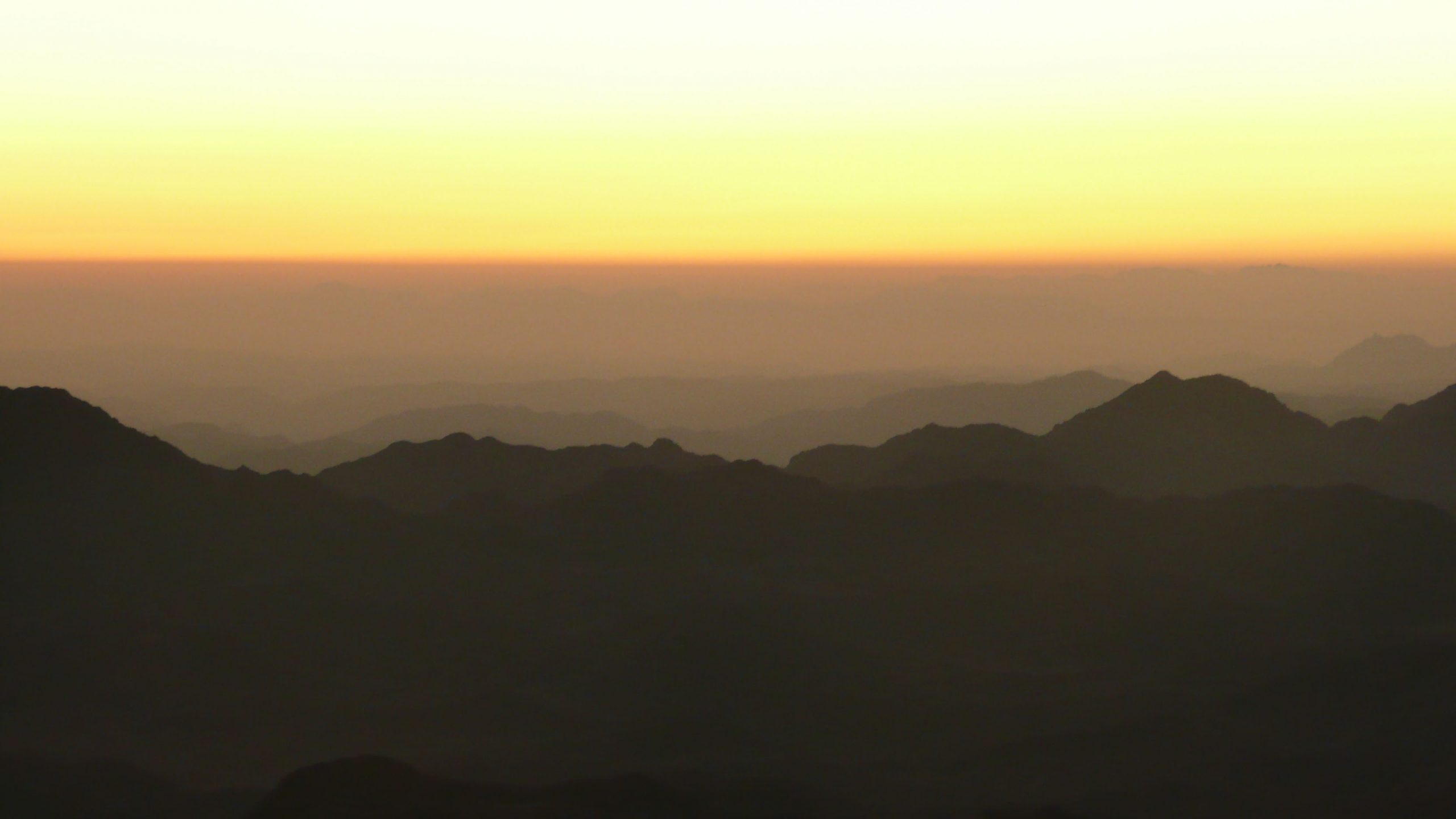 Yellow to orange sky at sunrise from Mt Sinai Egypt